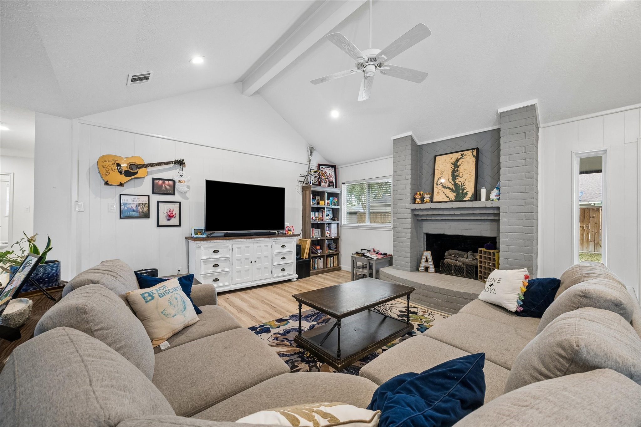 Open living area boasts vaulted ceilings & high-end luxury vinyl plank (LVP) flooring.
