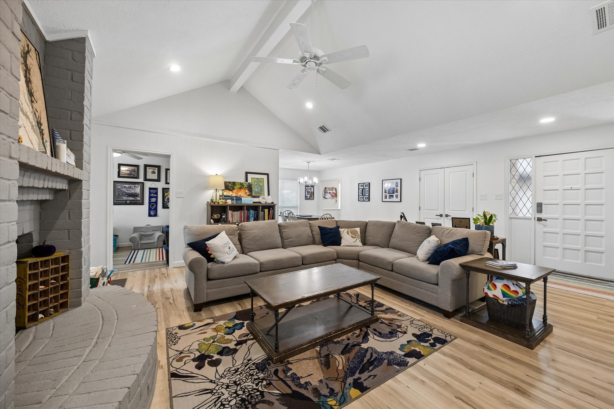 Another view of beautifully renovated living room with door leading to 4th bedroom or convenient study!