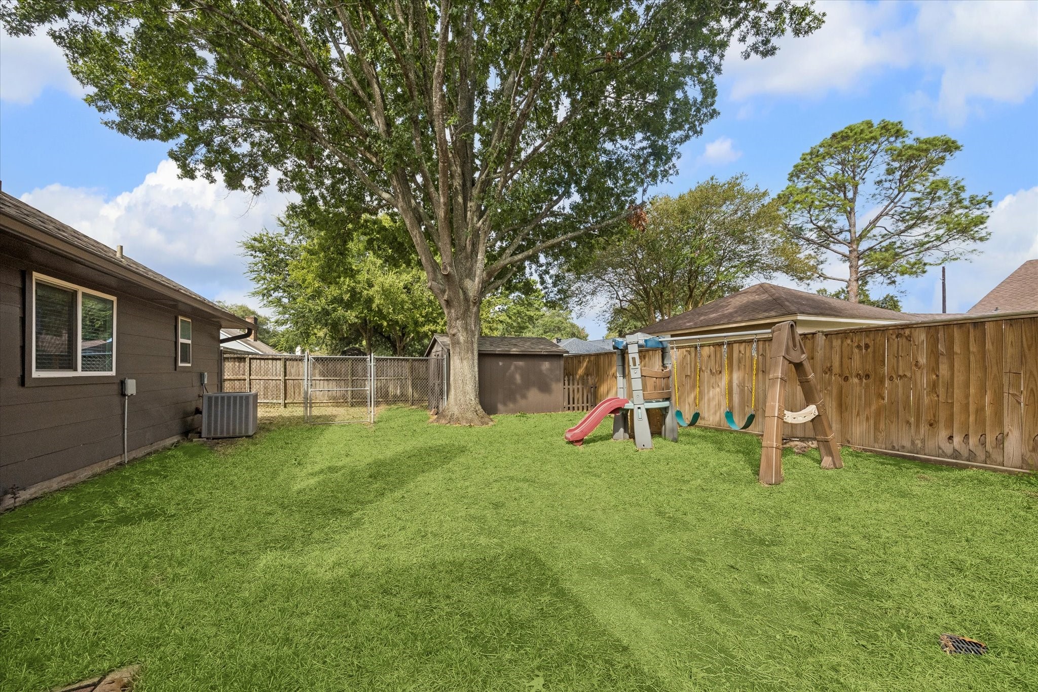 Spacious fenced yard with recent fencing is large enough to accommodate a pool or playset!