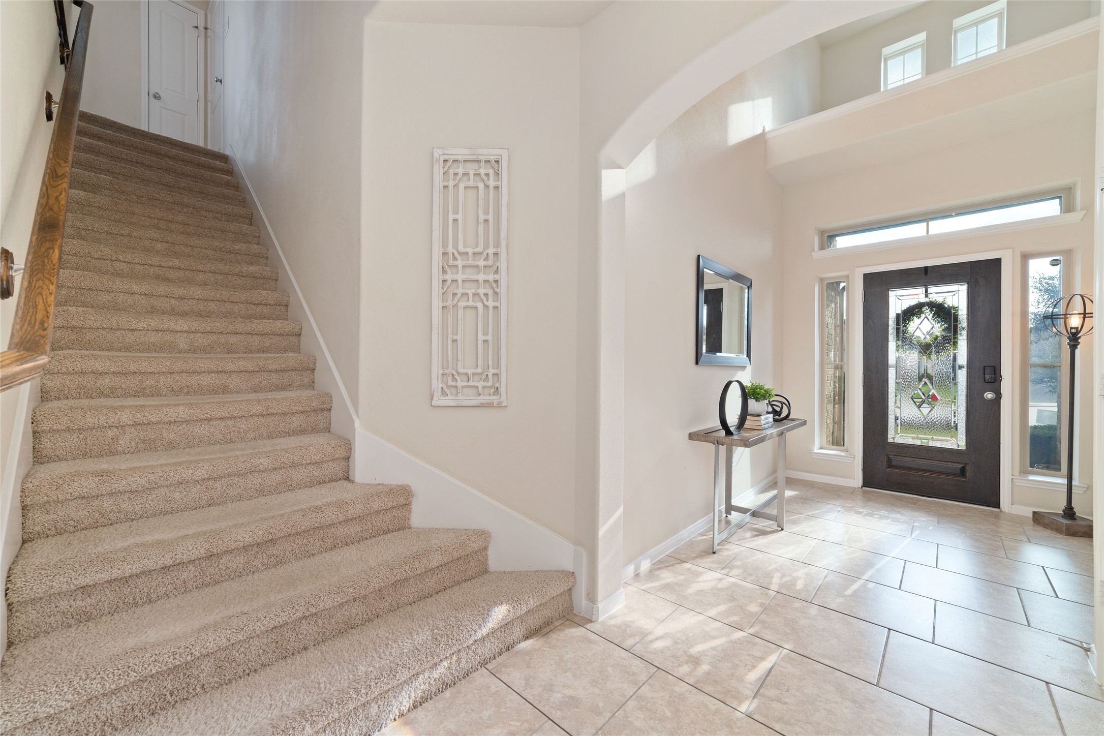 Stairs right off of the entry lead to secondary bed and bathrooms. Stairs right off of the entry lead to secondary bed and bathrooms.