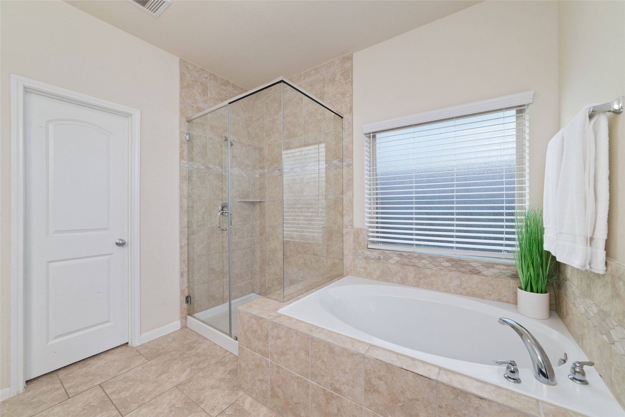 Separate shower and soaking tub create a relaxing retreat.