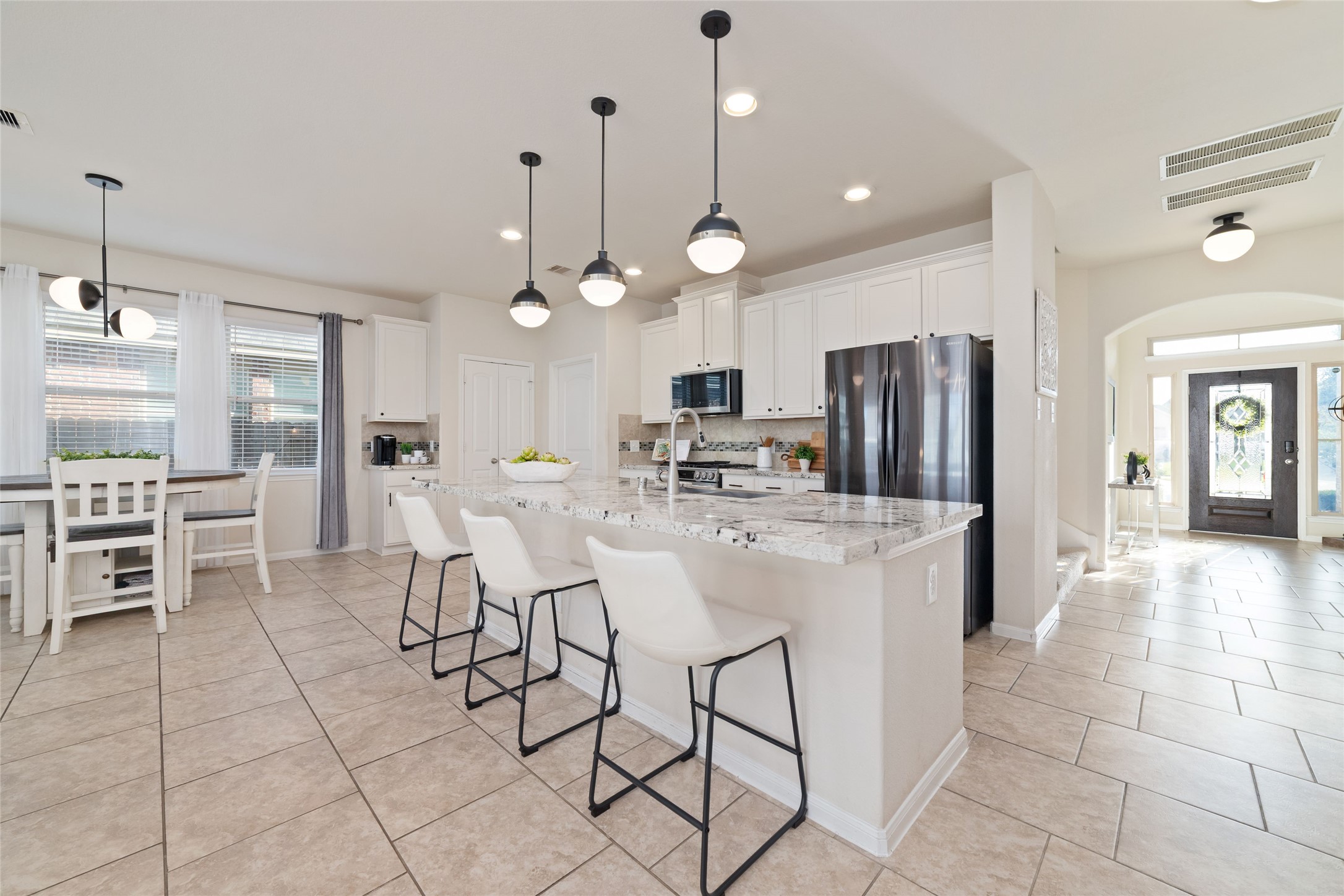 Beautiful and functional kitchen with a large island, plenty of countertop workspace and additional seating. Beautiful and functional kitchen with a large island, plenty of countertop workspace and additional seating.