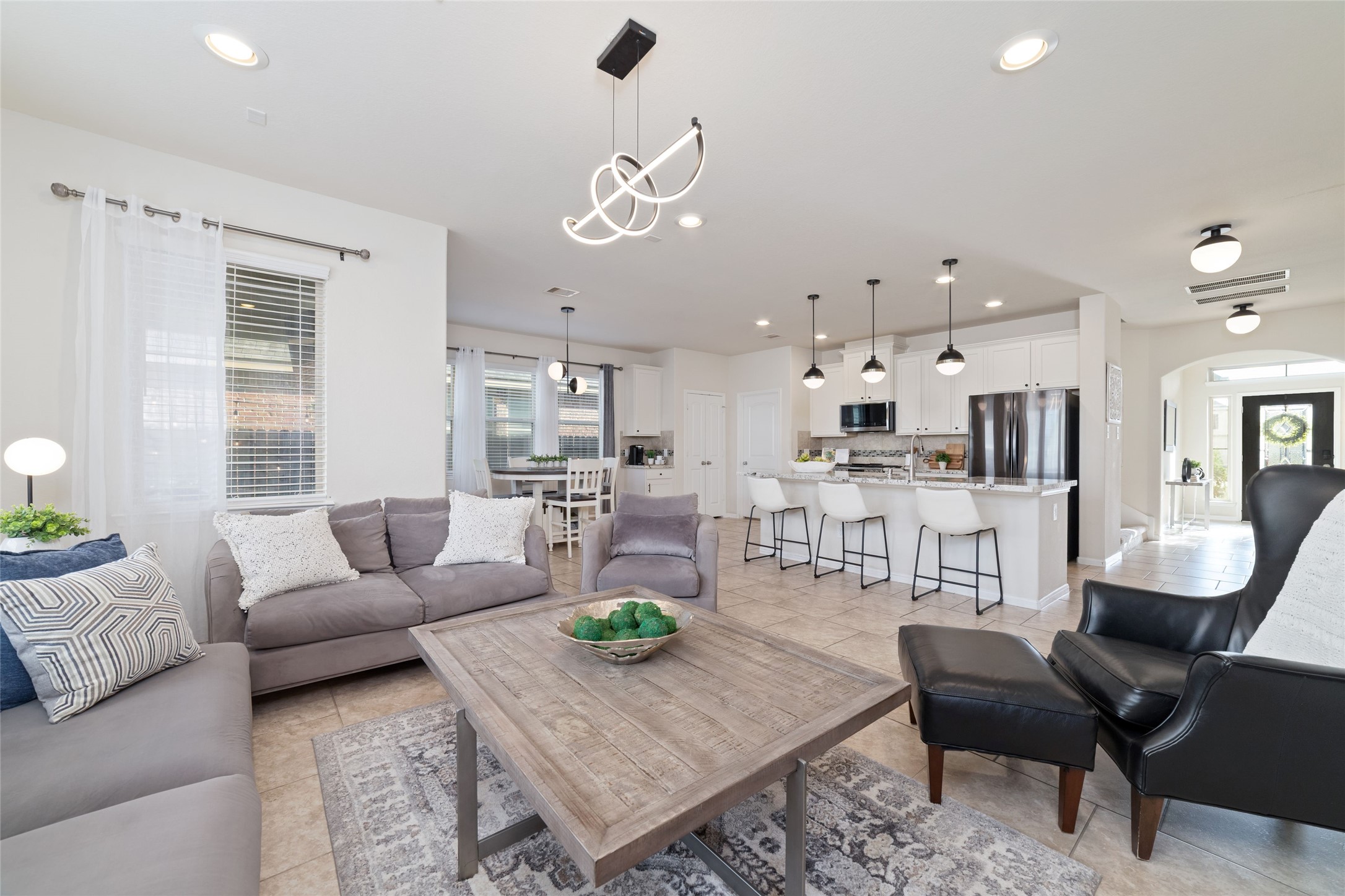 Another view of the open living area with seamless flow into the kitchen and breakfast room.