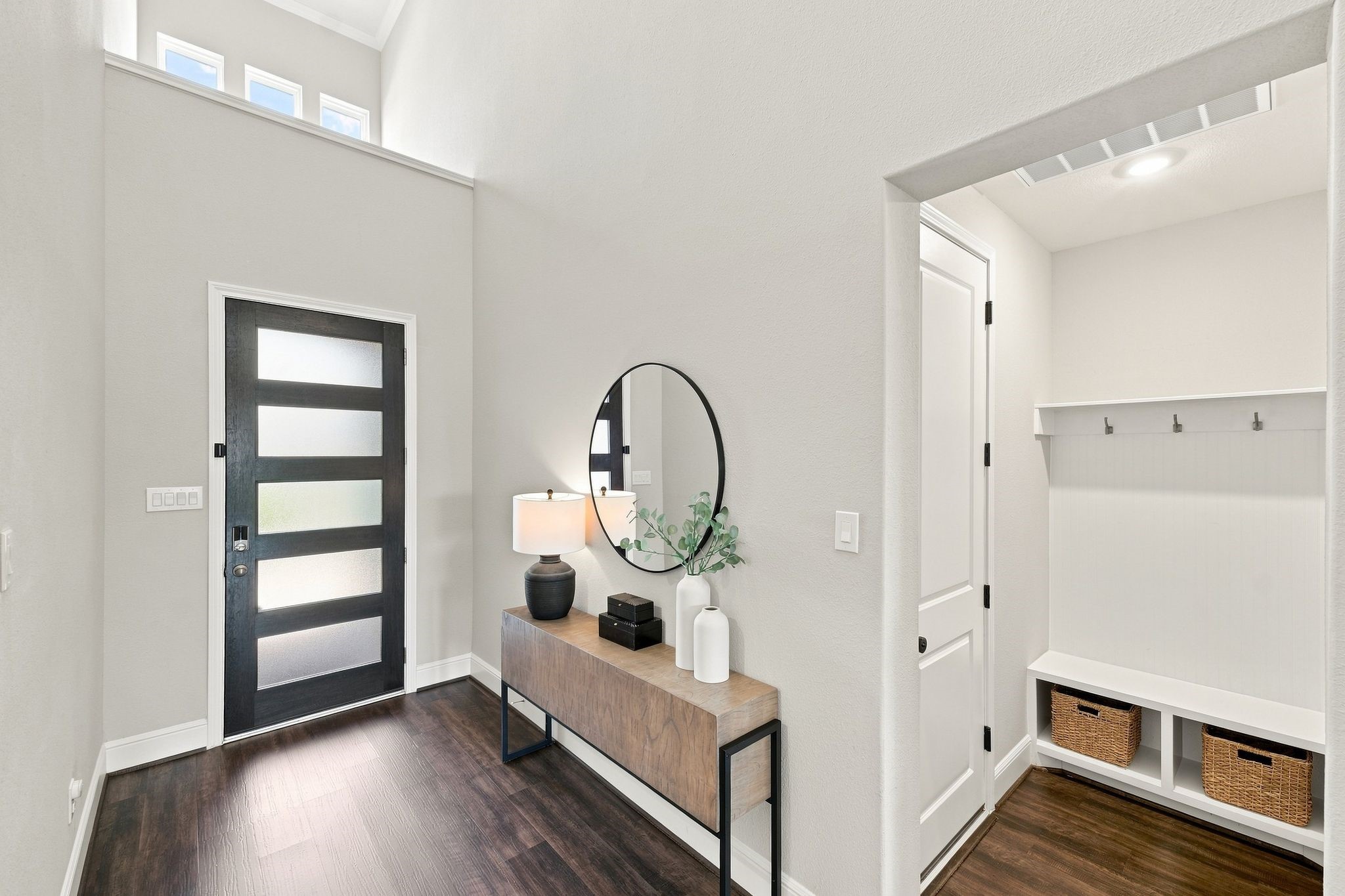 Entrance to the garage and foyer of the home, hosts an mudroom.