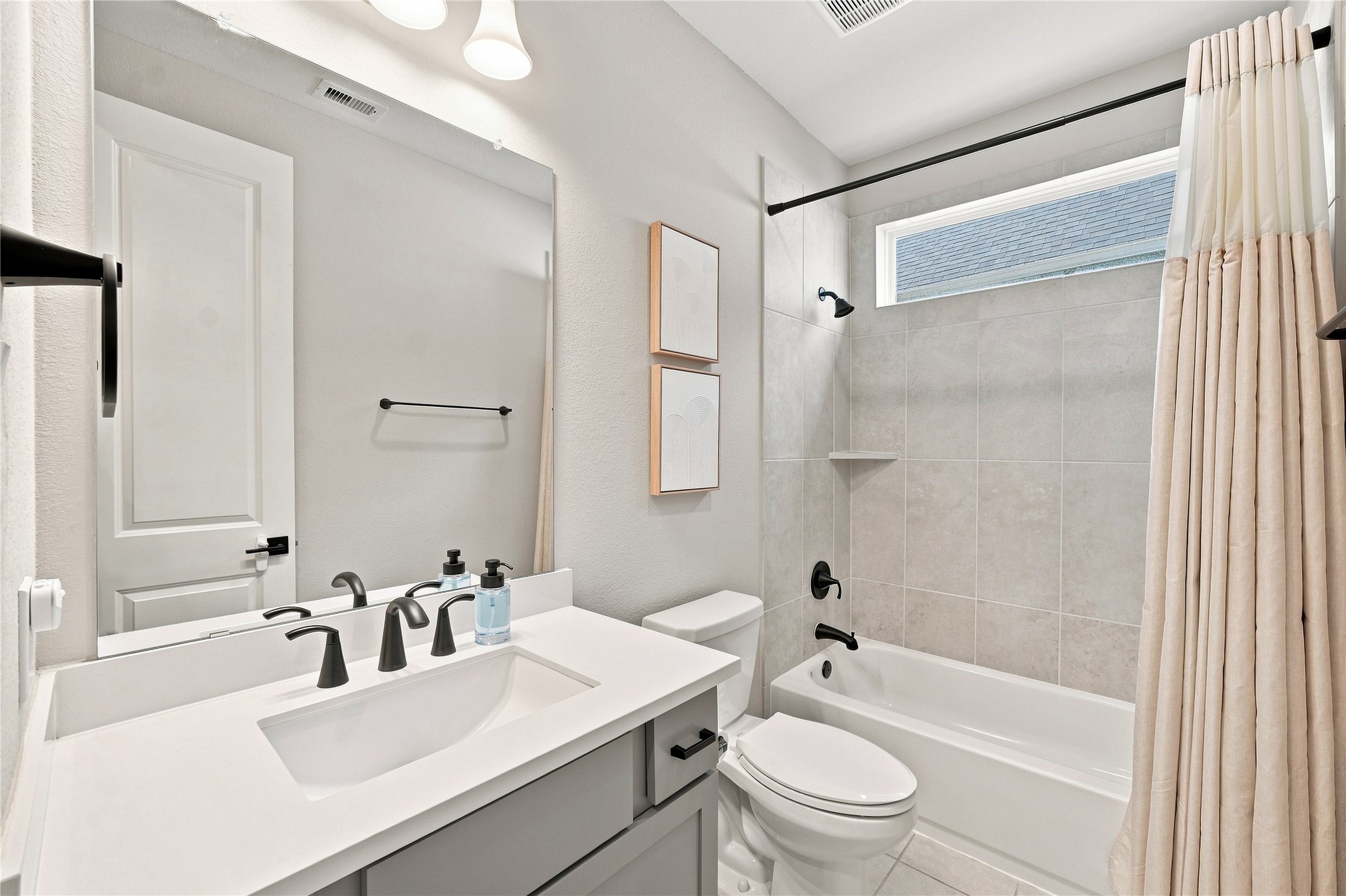Downstairs full bathroom is accessible to anyone on the first floor, but directly next to the bedroom (currently set up as a nursery).