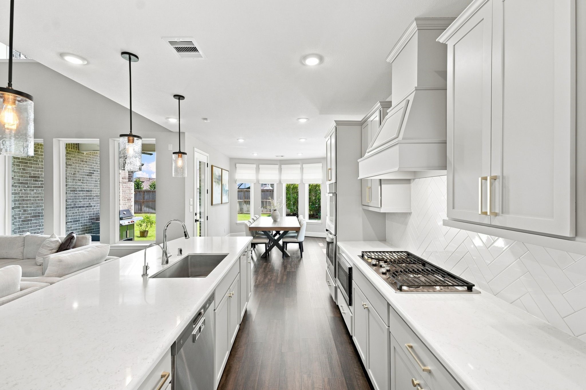 Kitchen opens to oversized breakfast/dining area that's flooded with natural light.