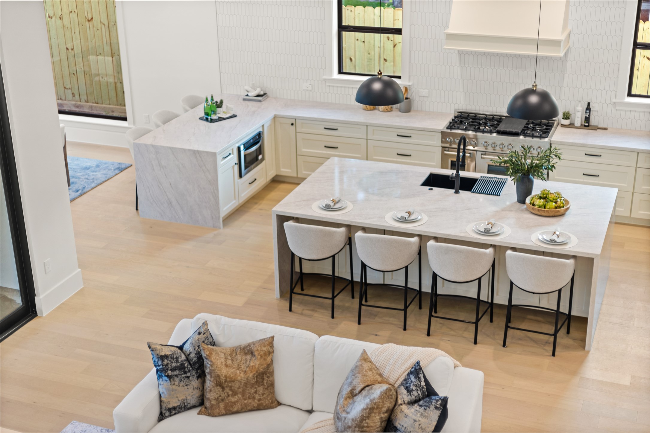 Your chefs kitchen makes every meal feel special with dual waterfall islands, premium appliances, abundant cabinetry, and plenty of space for gathering. Your chefs kitchen makes every meal feel special with dual waterfall islands, premium appliances, abundant cabinetry, and plenty of space for gathering.