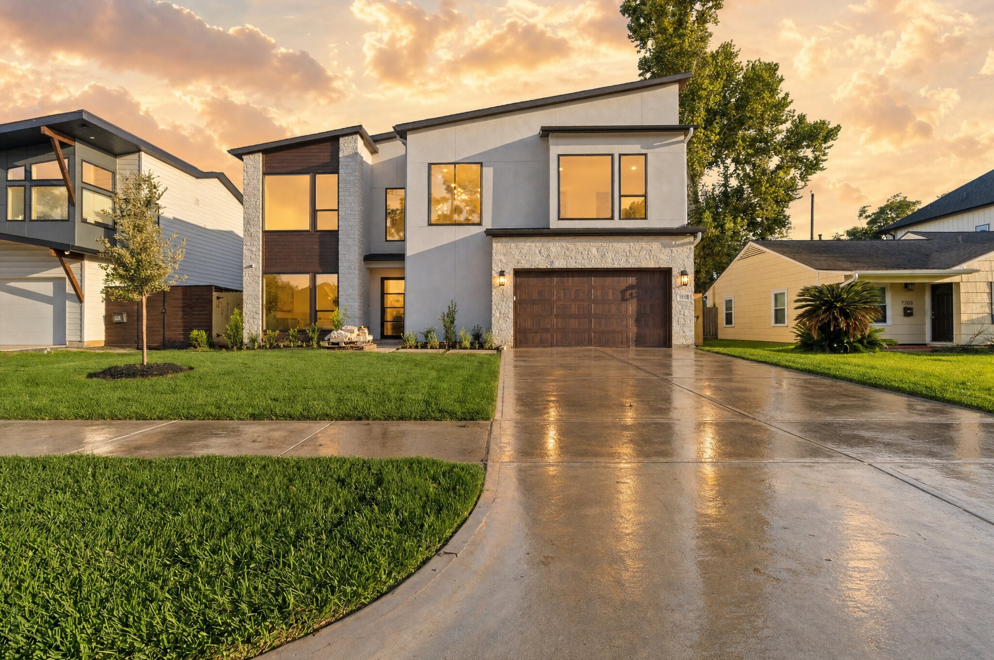 Striking curb appeal welcomes you home to this stunning contemporary residence. A sophisticated blend of stone, stucco, and rich wood accents creates a bold, modern facade, while expansive overzsized windows flood the interior with natural light.