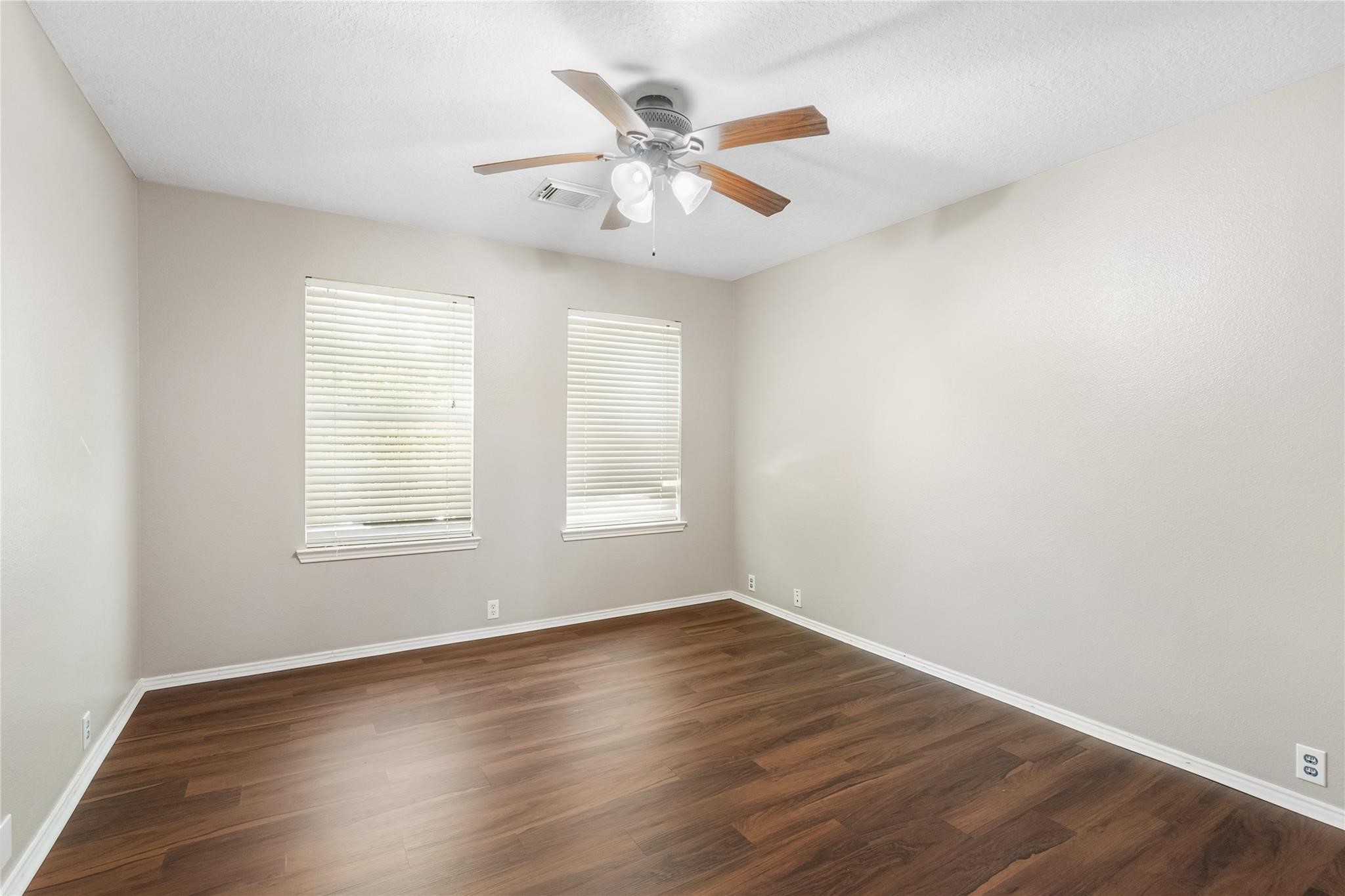 There are 3 secondary windows, and each one has bright and neutral paint, and windows that invite natural light to flow in.