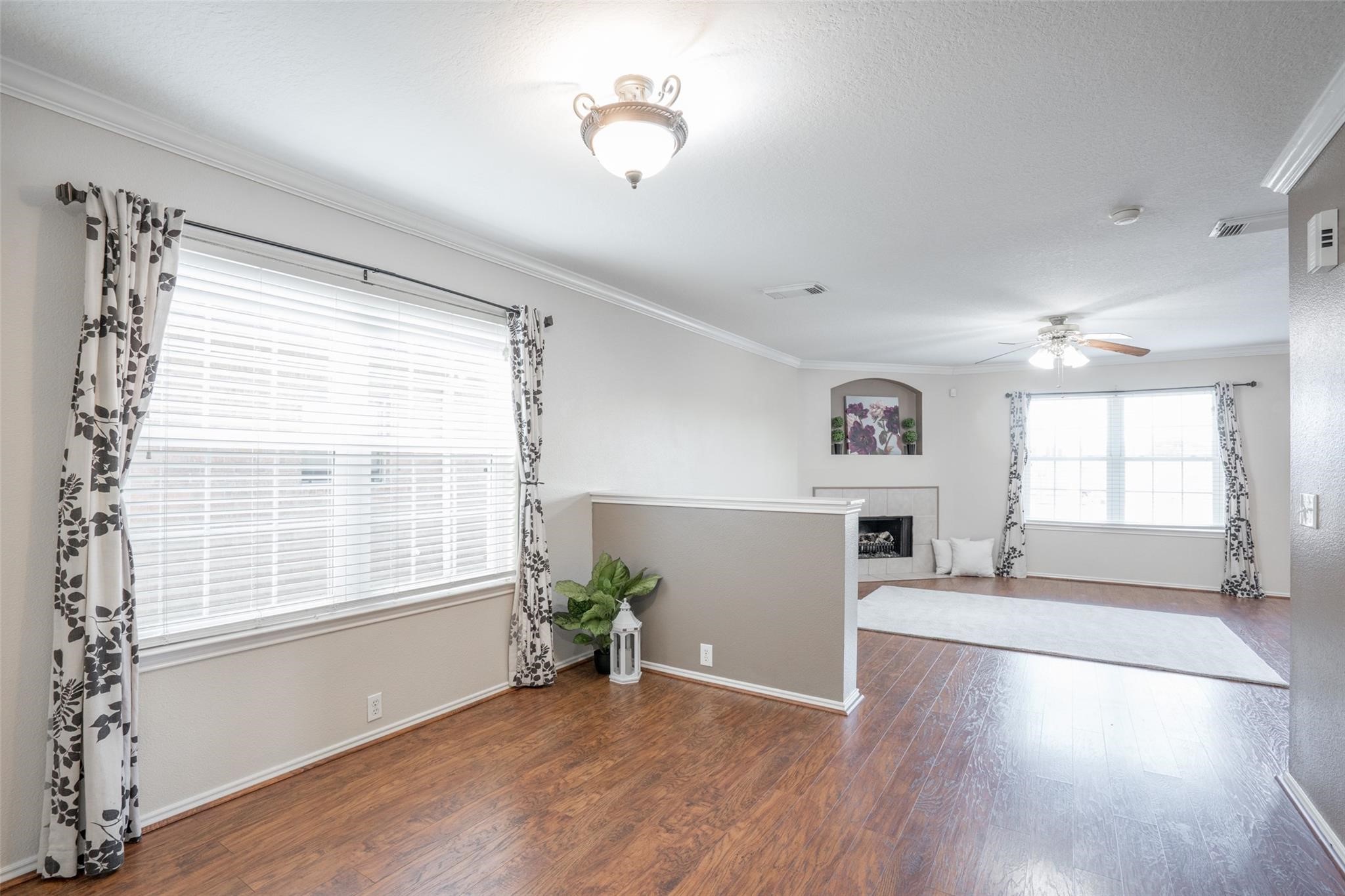 As soon as you enter, you will be wowed by the open concept design, large and bright windows, and gleaming wood-like floors.