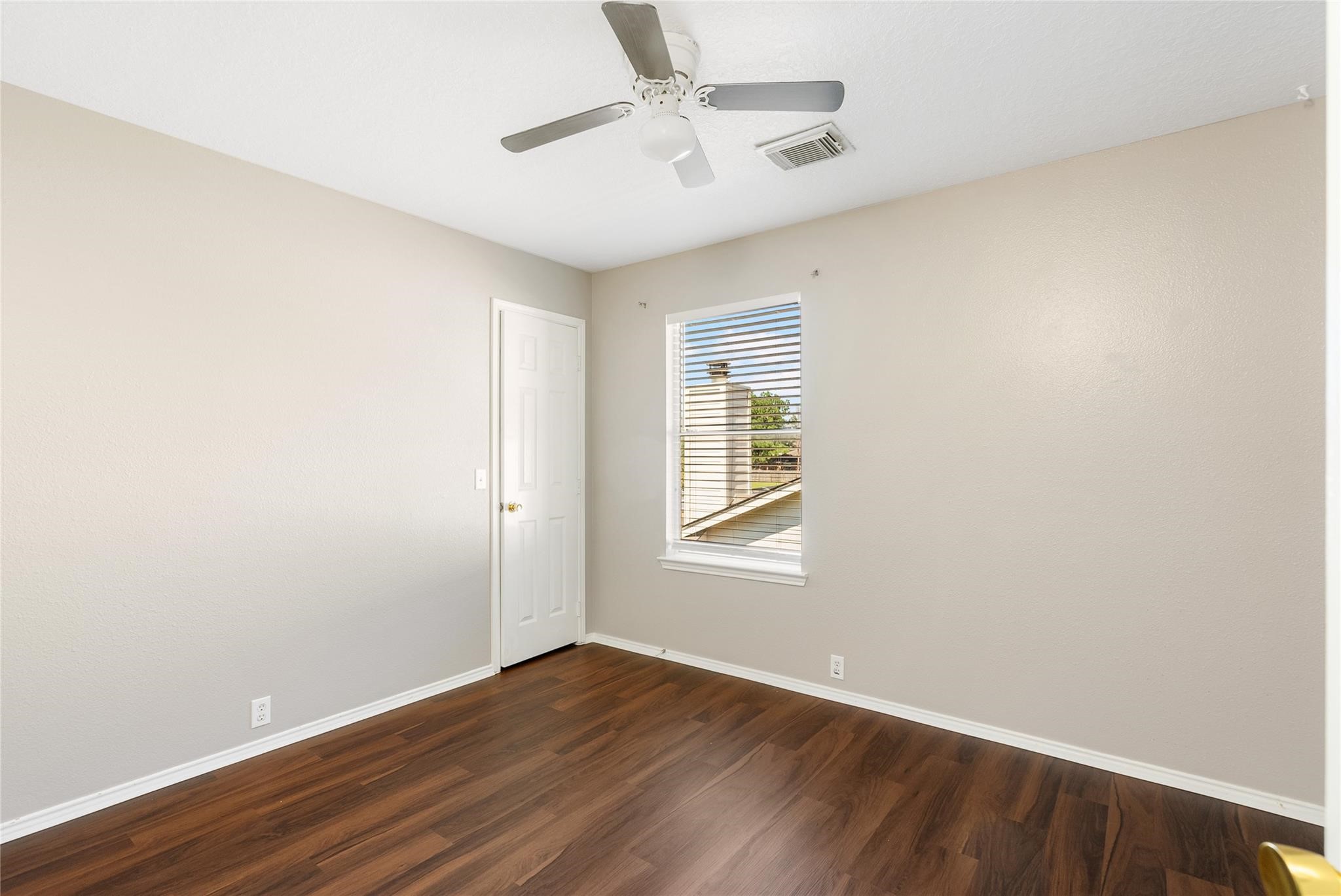 Sleek wood-look floors flow through each bedroom!