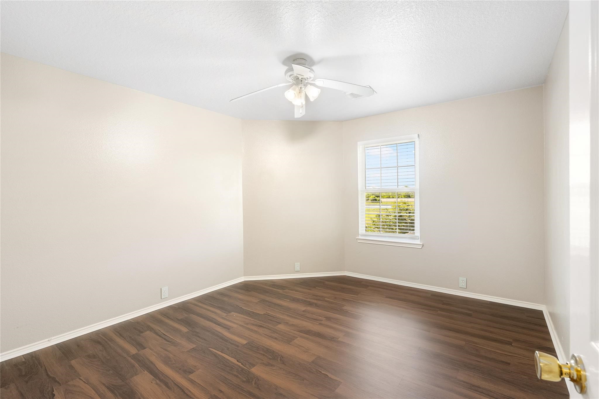 Bright and airy, each secondary bedroom also has a ceiling fan!