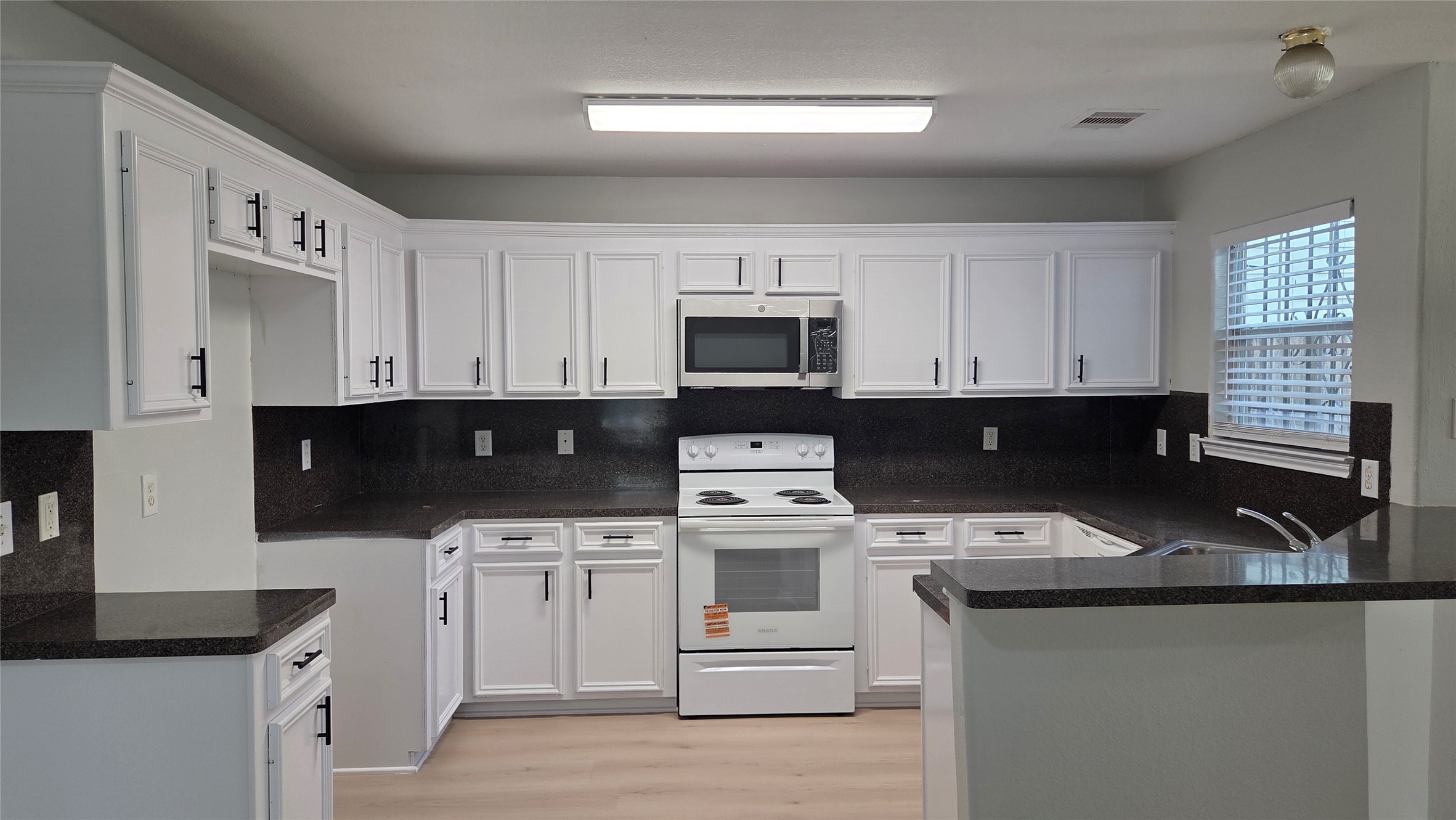 Unit B - Kitchen with New Stainless Steall Microwave