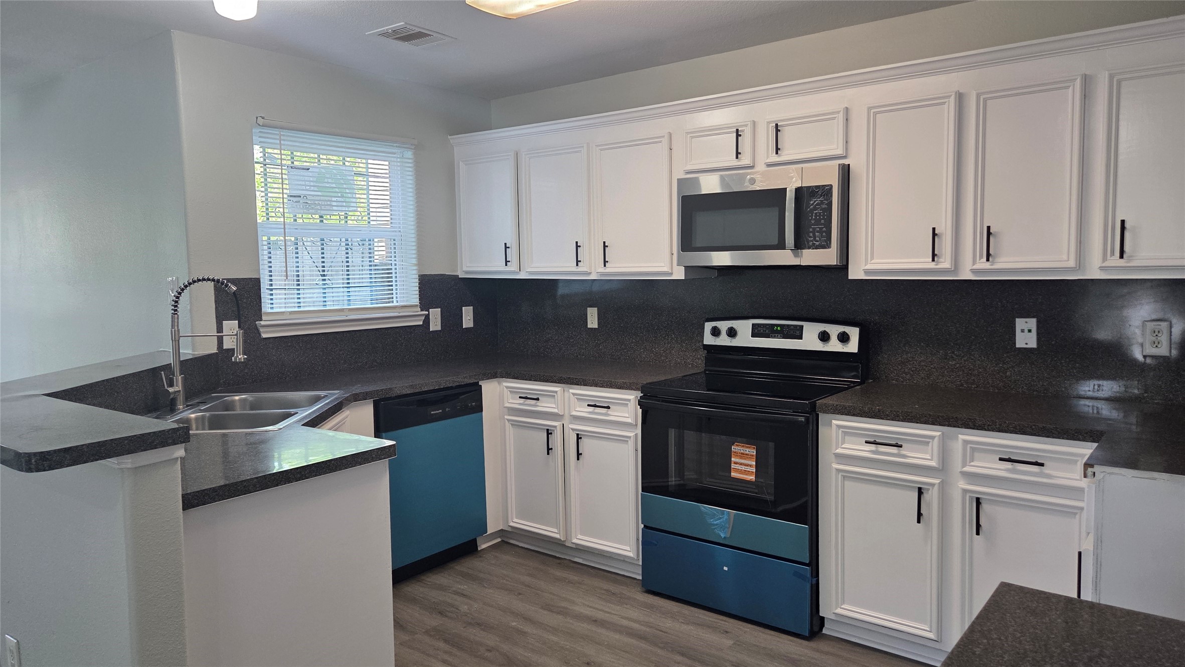 Unit A - Kitchen with New Stainless Steel Appliances Unit A - Kitchen with New Stainless Steel Appliances