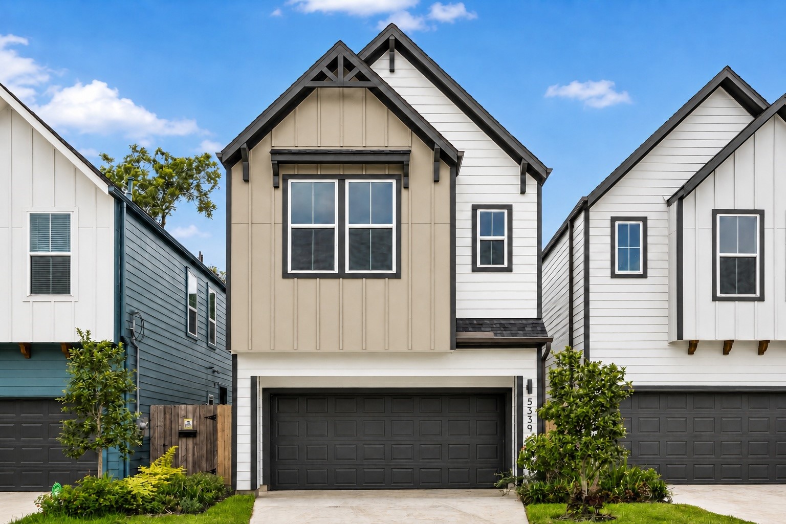 Elegant front elevation wth covered private driveway.