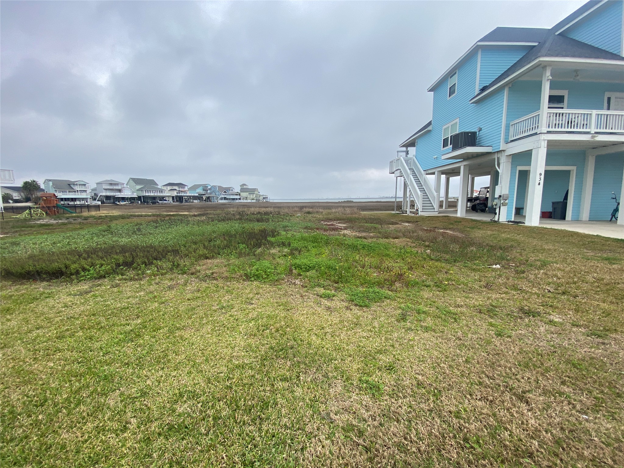 Lot 22 - to the left of the blue house.