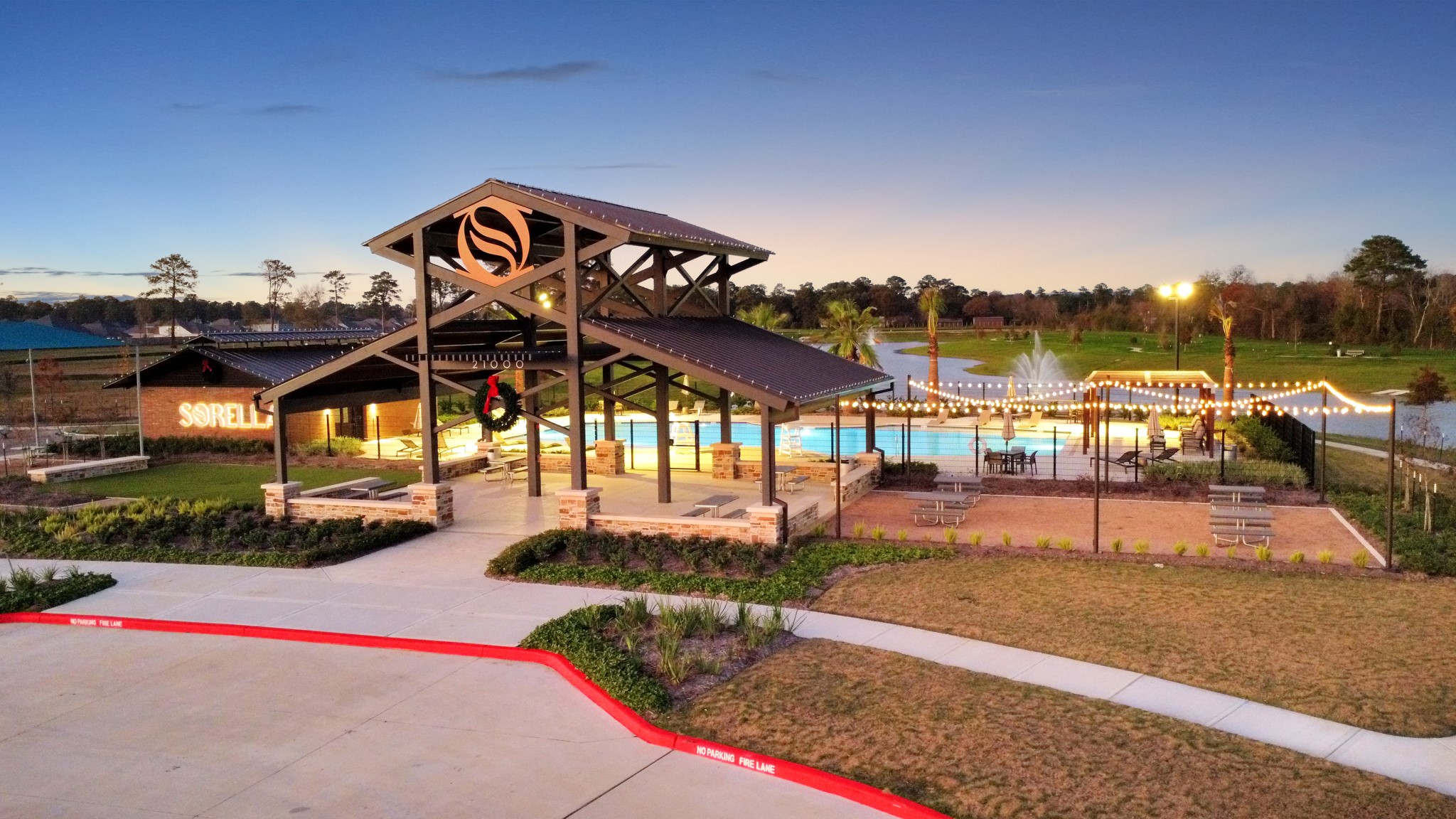 The community features serene lakeside walking trails that wind around a picturesque pond, perfect for evening strolls or morning jogs.