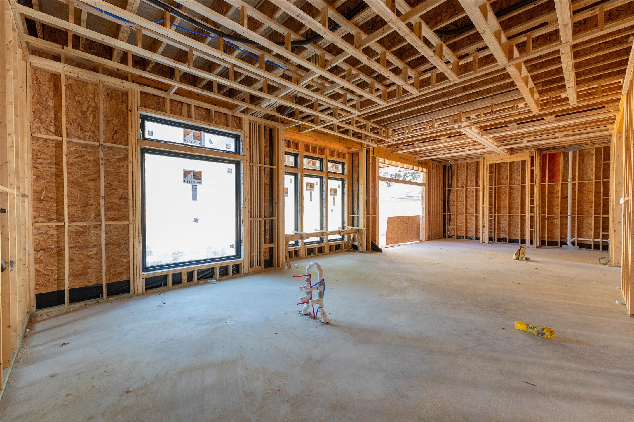 Kitchen, Breakfast & Family Room view from the back. Construction photo taken 10/22/26
