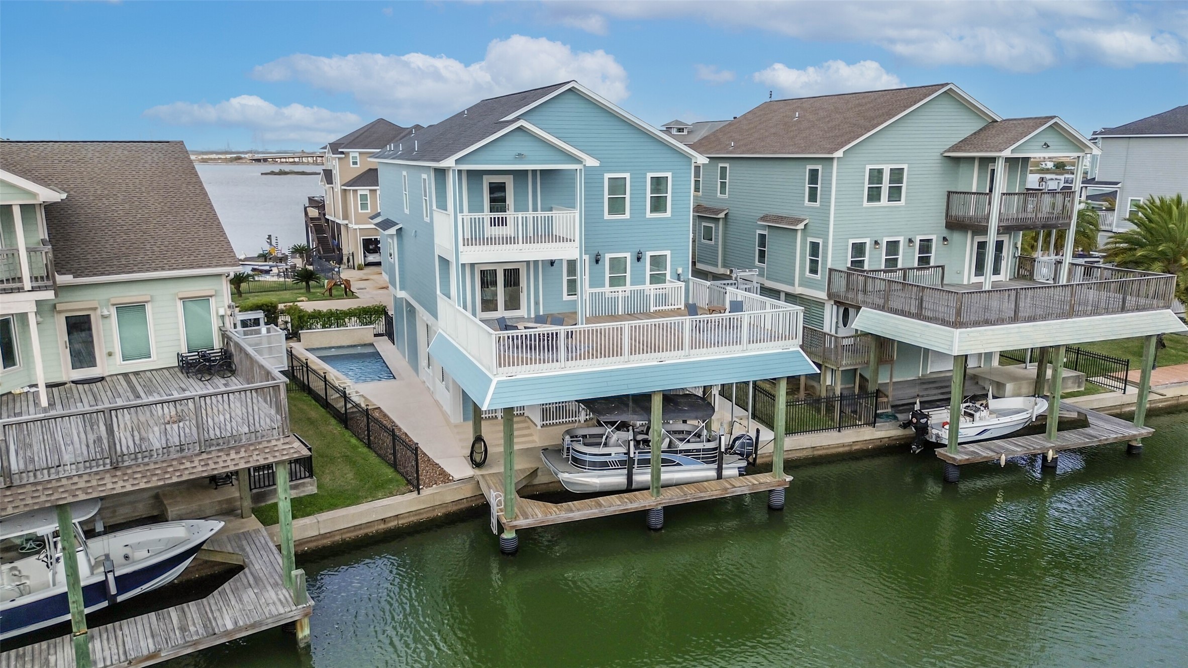 Elevated construction with covered parking and classic coastal architecture designed for island living.