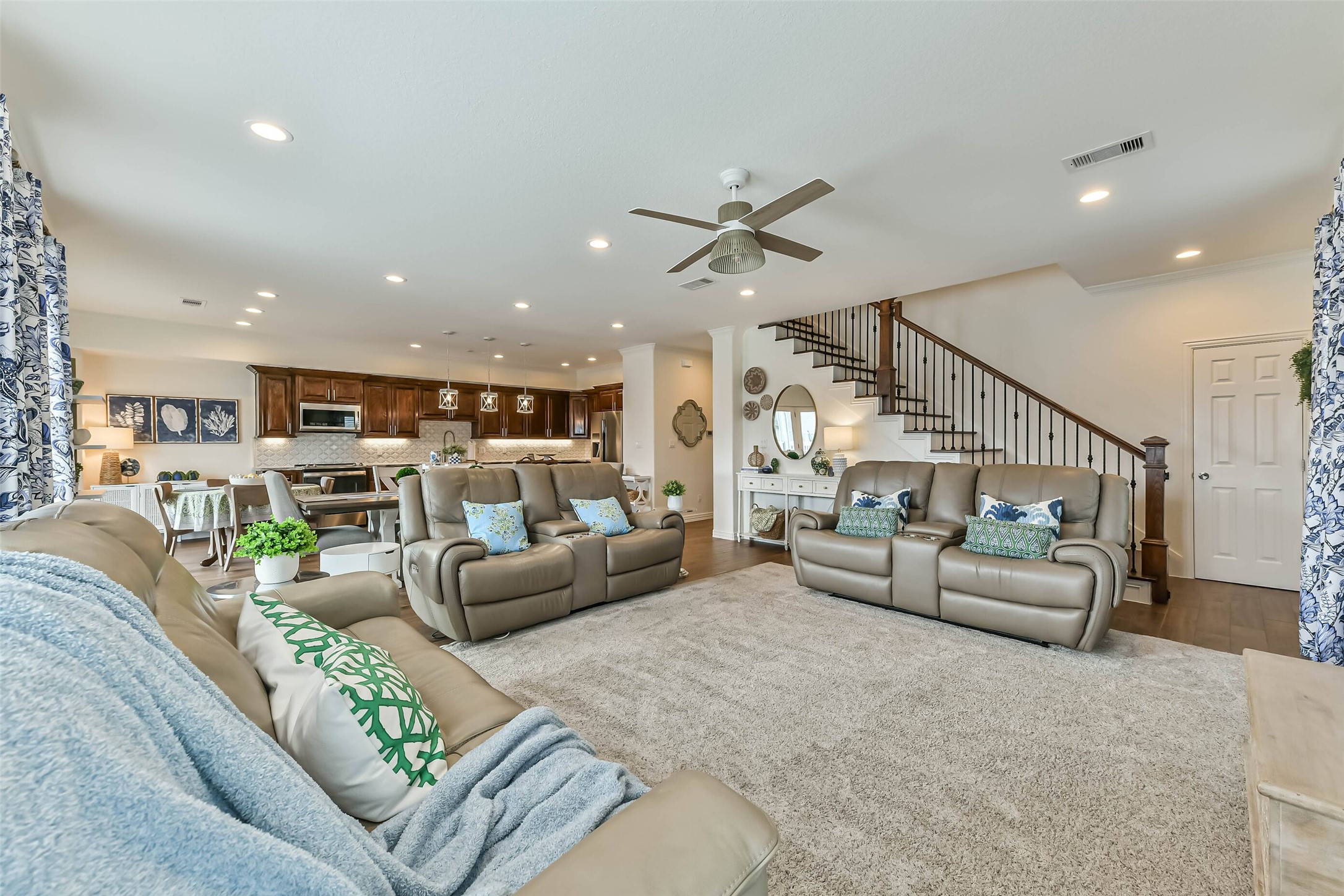 Bright and spacious living area featuring large windows that frame beautiful canal views while filling the space with natural sunlight.