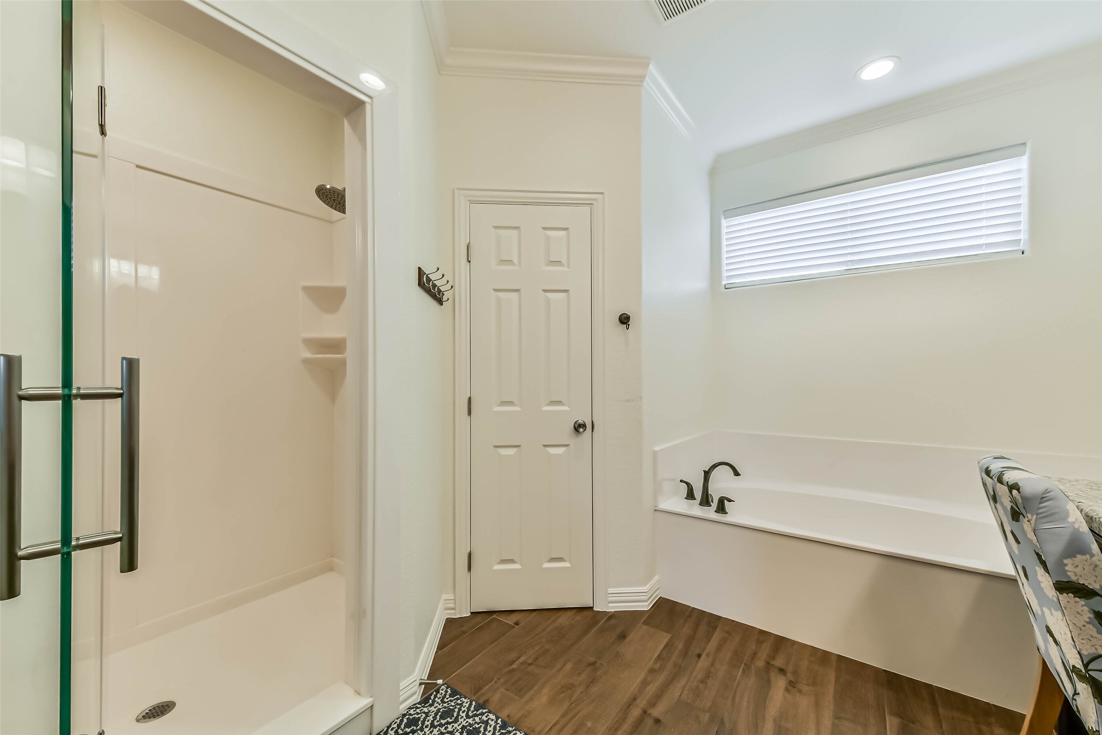 Clean, neutral finishes and durable flooring create a bright and practical bathroom space ideal for everyday use.