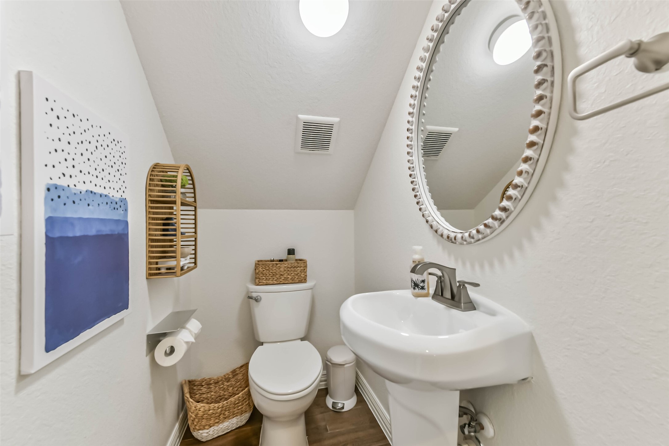 Compact and efficient powder room provides added convenience for entertaining and everyday use.
