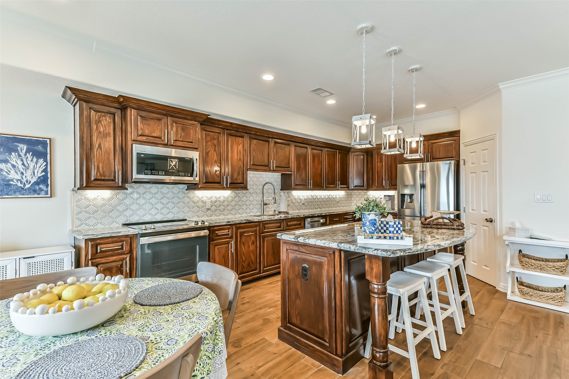 A chefs kitchen designed for entertaining with generous counter space and an oversized island.