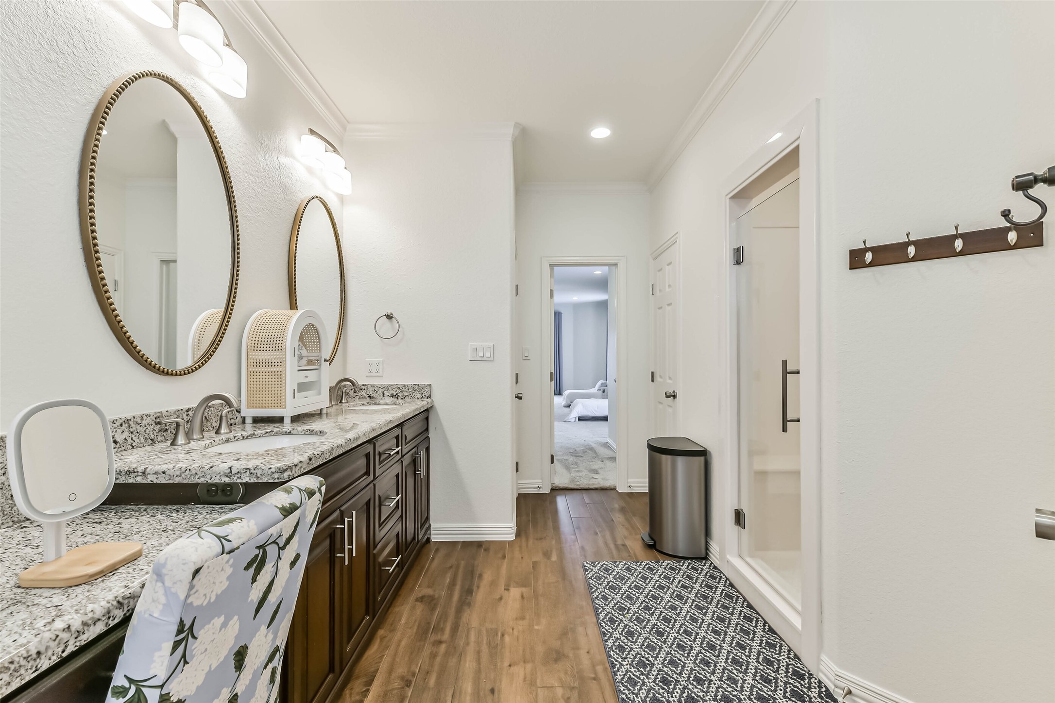 Inviting bath offers a large walk-in shower, dual sinks, and a functional layout designed for comfort and everyday convenience.