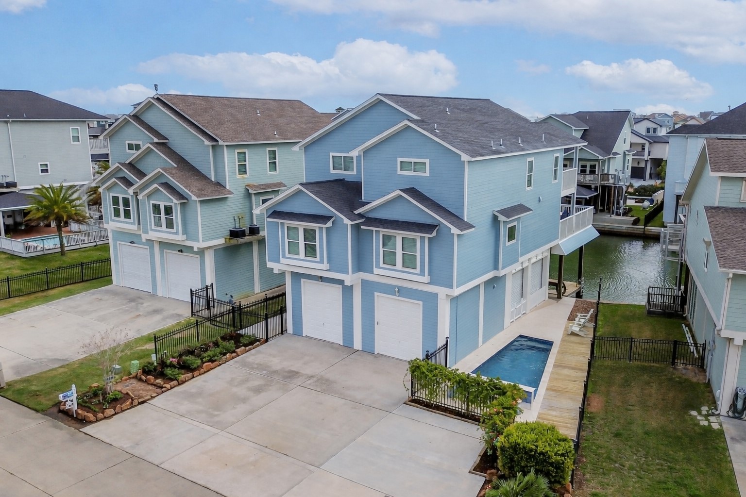 Coastal elegance meets waterfront living in this beautifully designed Tiki Island retreat.