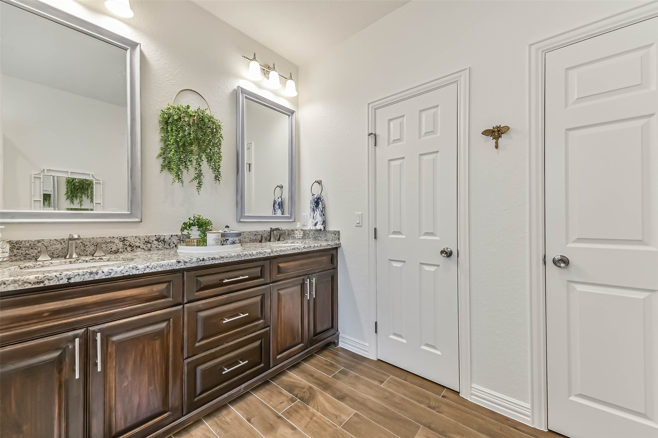 Well-designed vanity provides plenty of surface space and storage, making shared use convenient for guests or family.