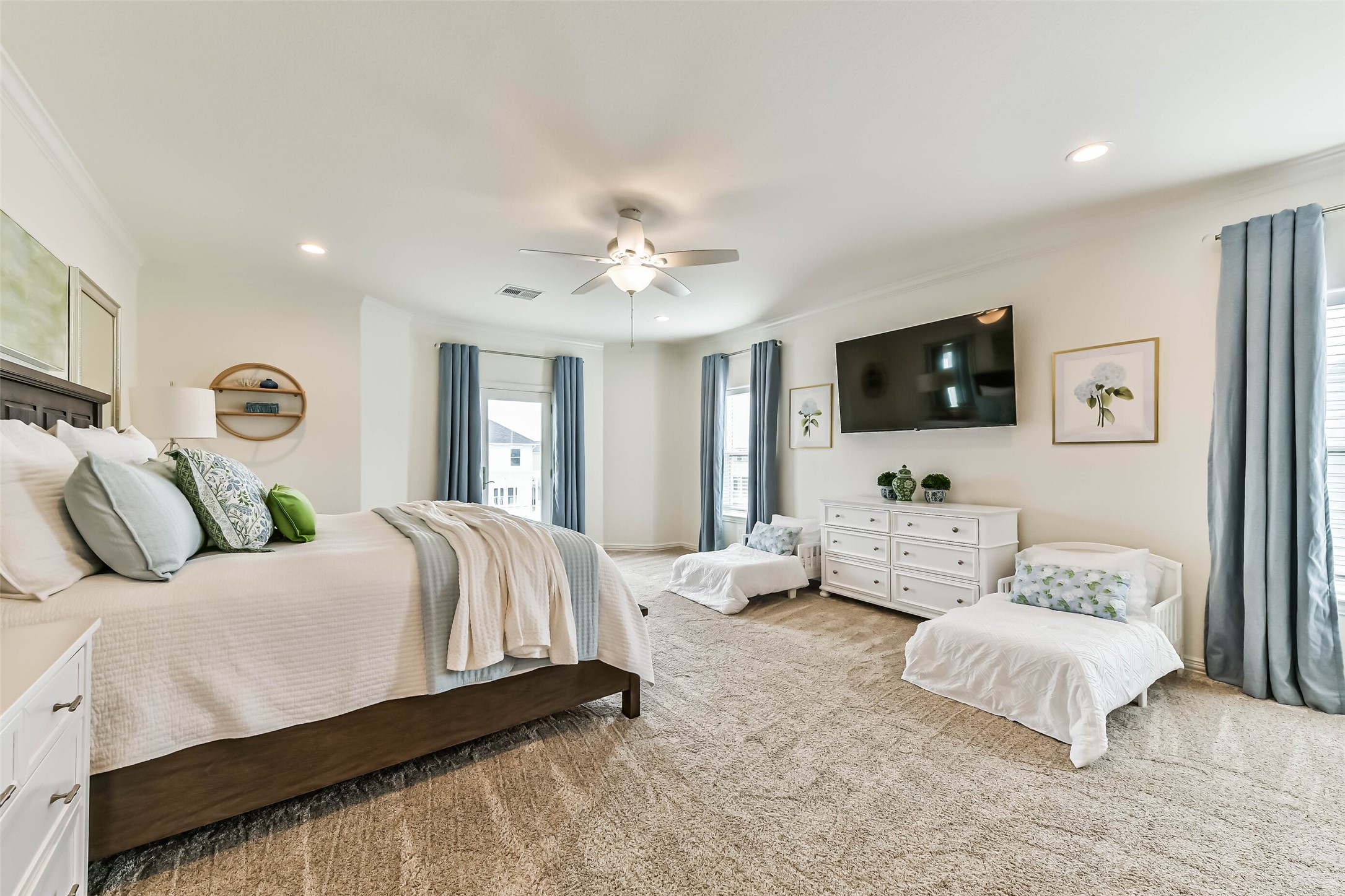 Wake up to peaceful water views from the spacious primary retreat.
