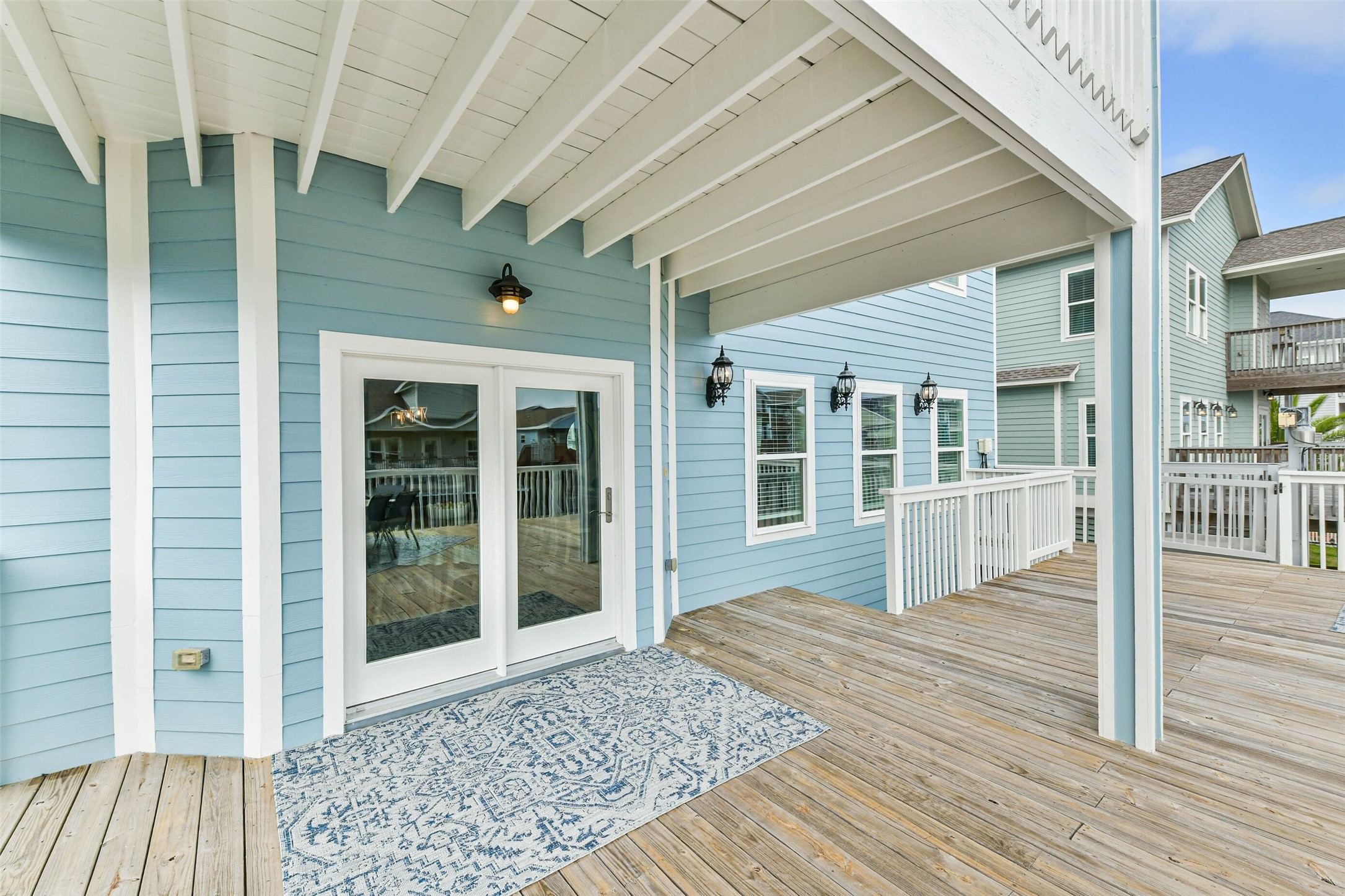 Beautiful patio area is complemented by double glass doors that allow natural light inside while creating an easy transition for entertaining.