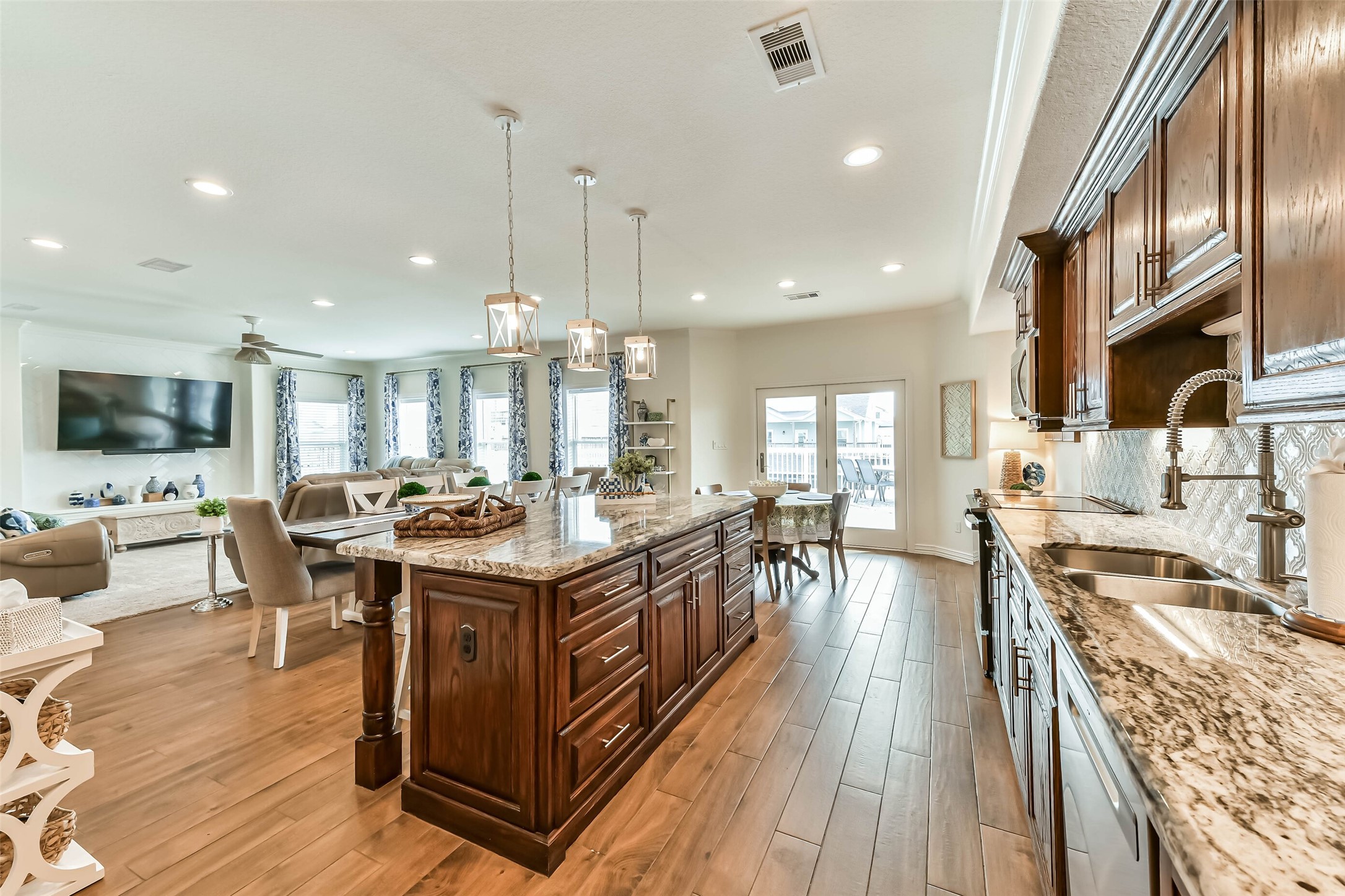 Gather around the island where conversations and coastal meals come together.
