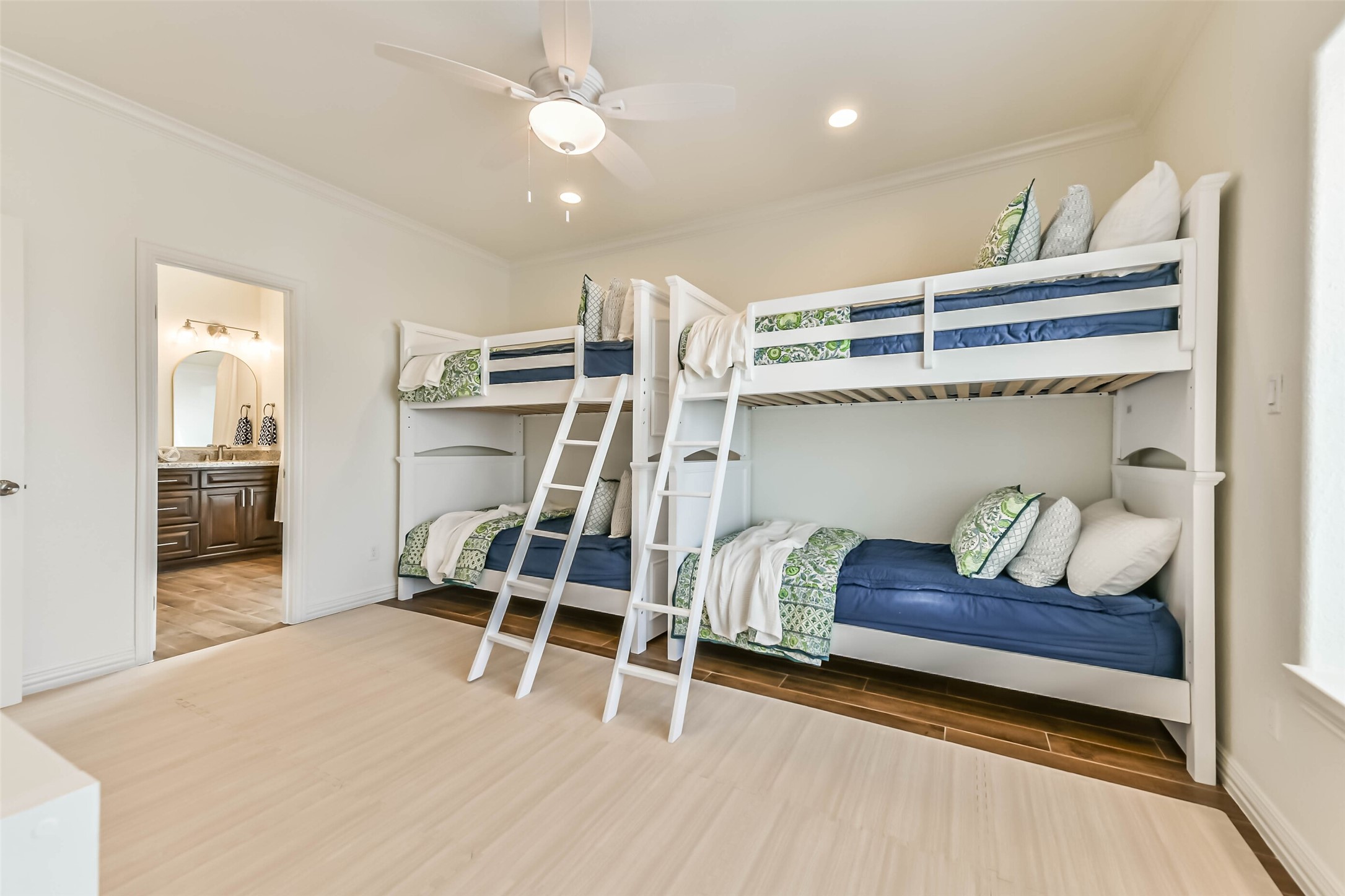 Bright and comfortable sleeping space showcases efficient layout and move-in-ready furnishings designed for convenience and comfort.