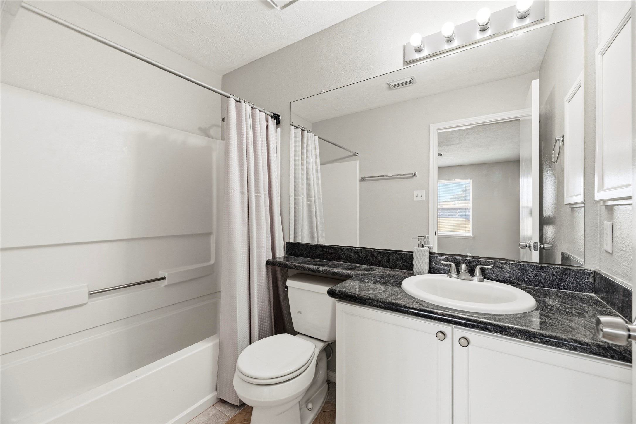 Upstairs full bathroom with a tub/shower combination.