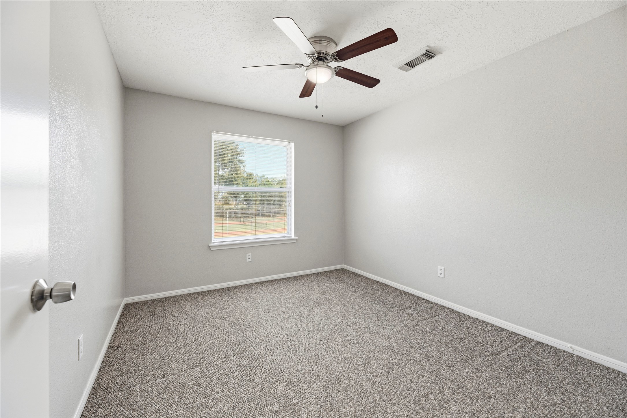 Both upstairs bedrooms have ceiling fans and ample closet space.