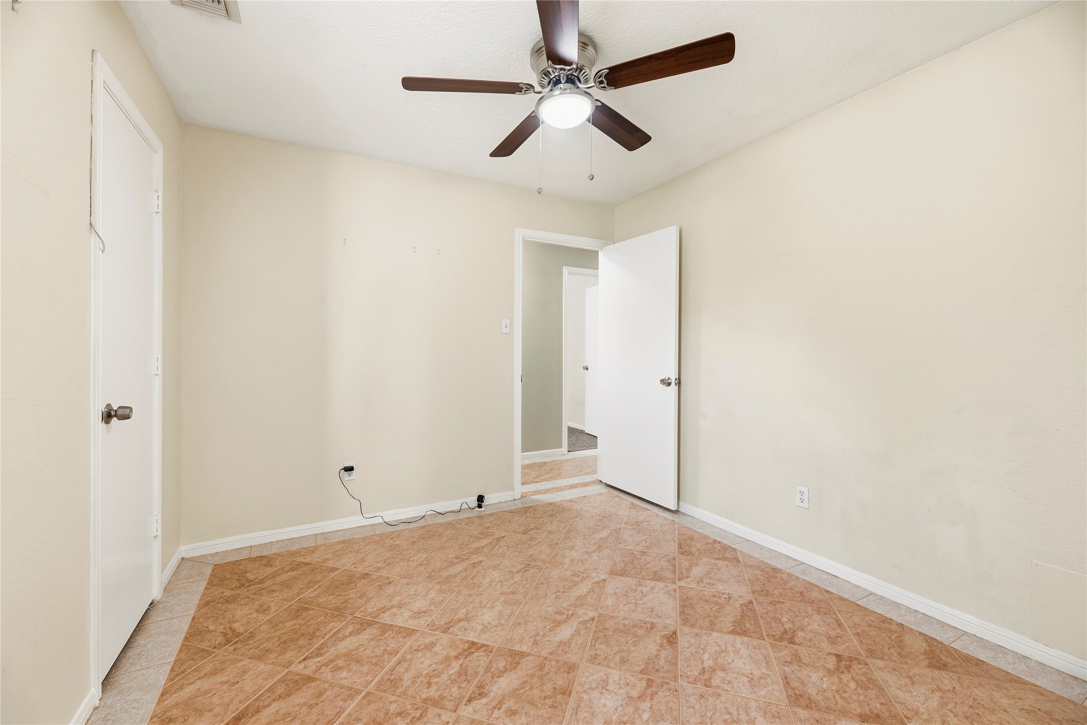 Versatile downstairs flex room with a closet. Could be a 5th bedroom or home office.
