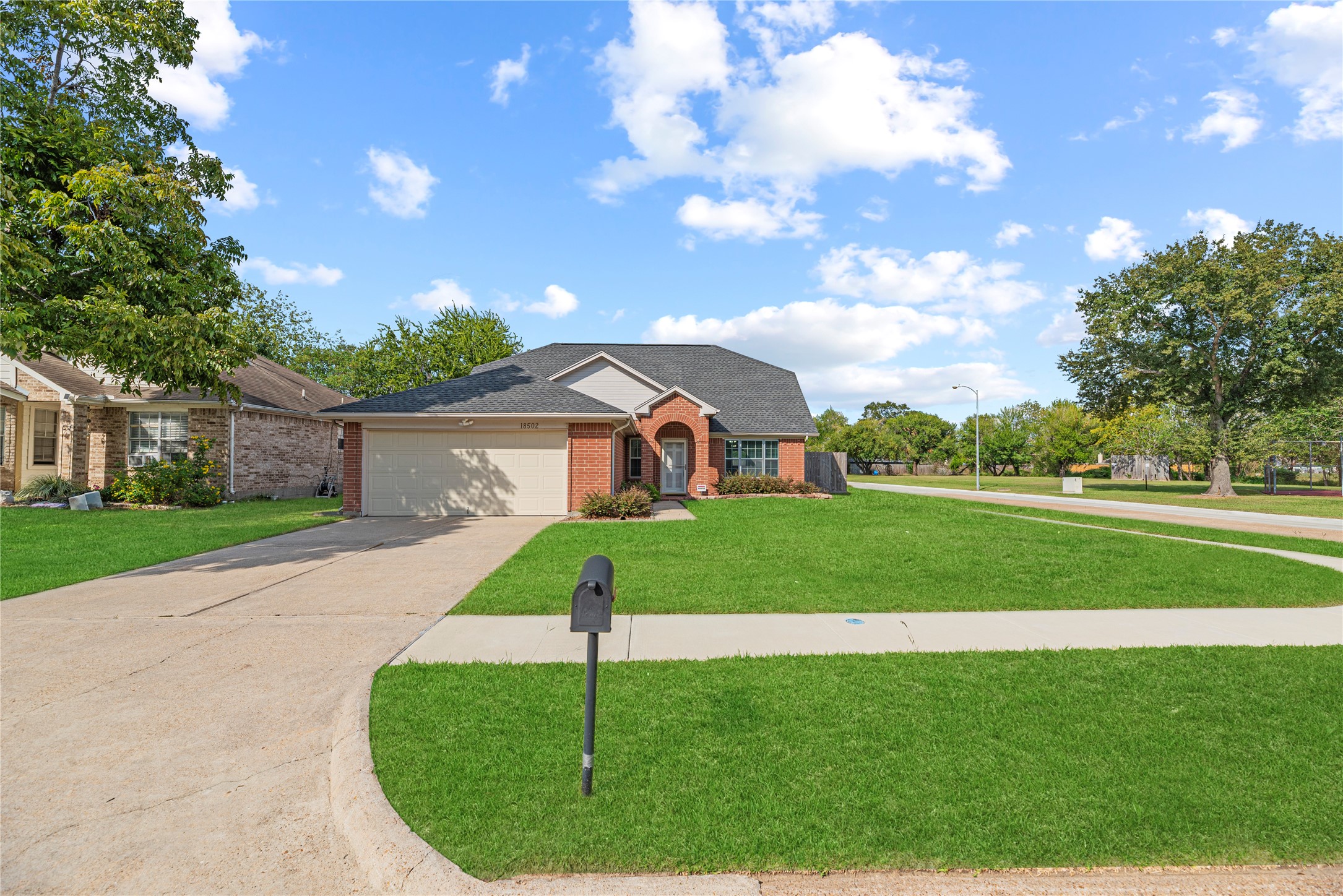 Lovely 2-story home with an attached 2-car garage and double-wide driveway.