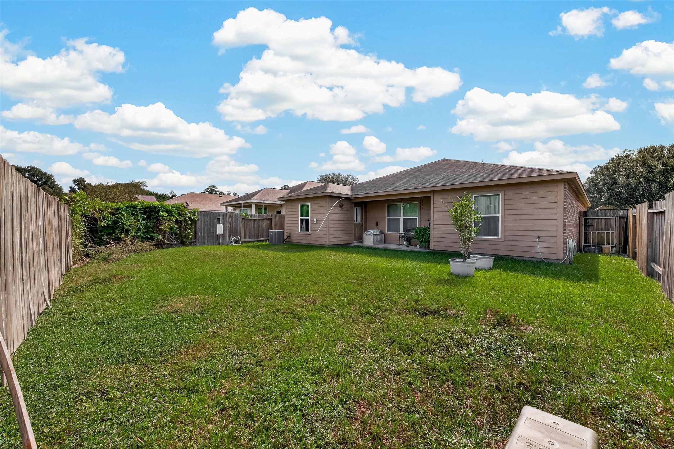 Spacious yard with covered patio.