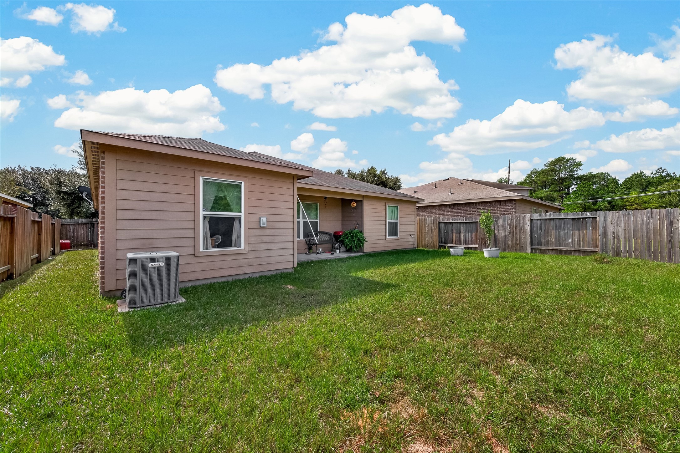 Spacious yard with covered patio.