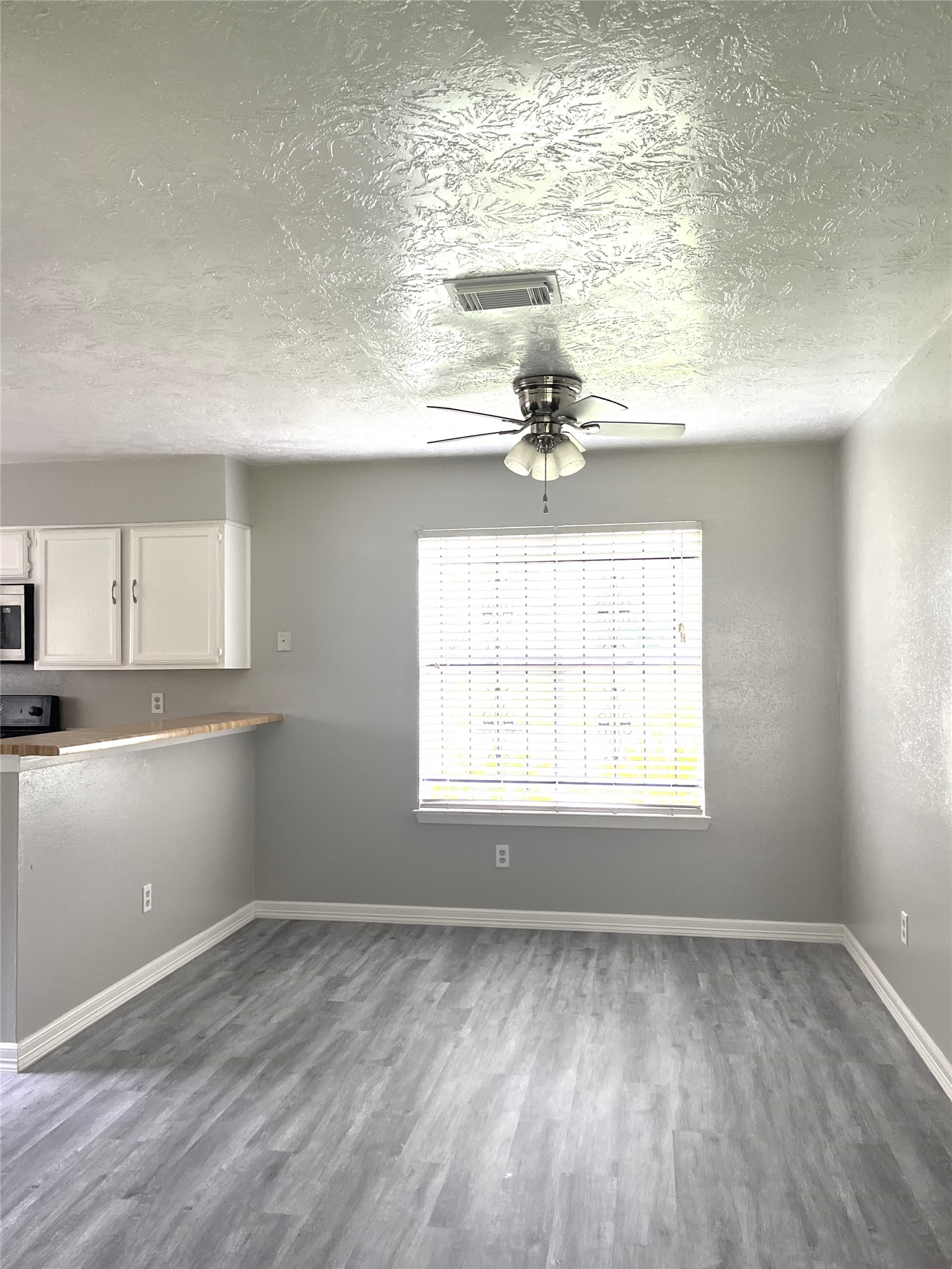 Breakfast bar separates kitchen from dining area