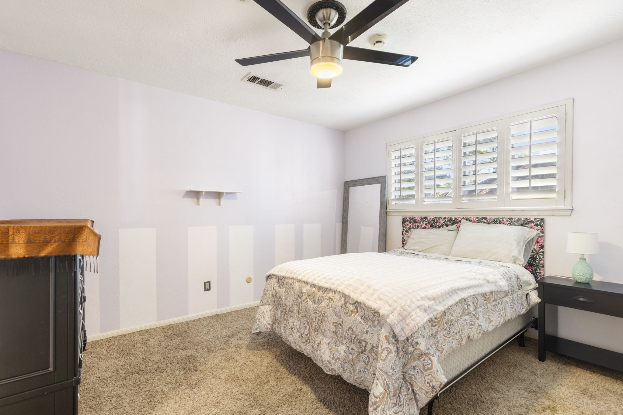 The secondary bedrooms are all elevated by plantation shutters.