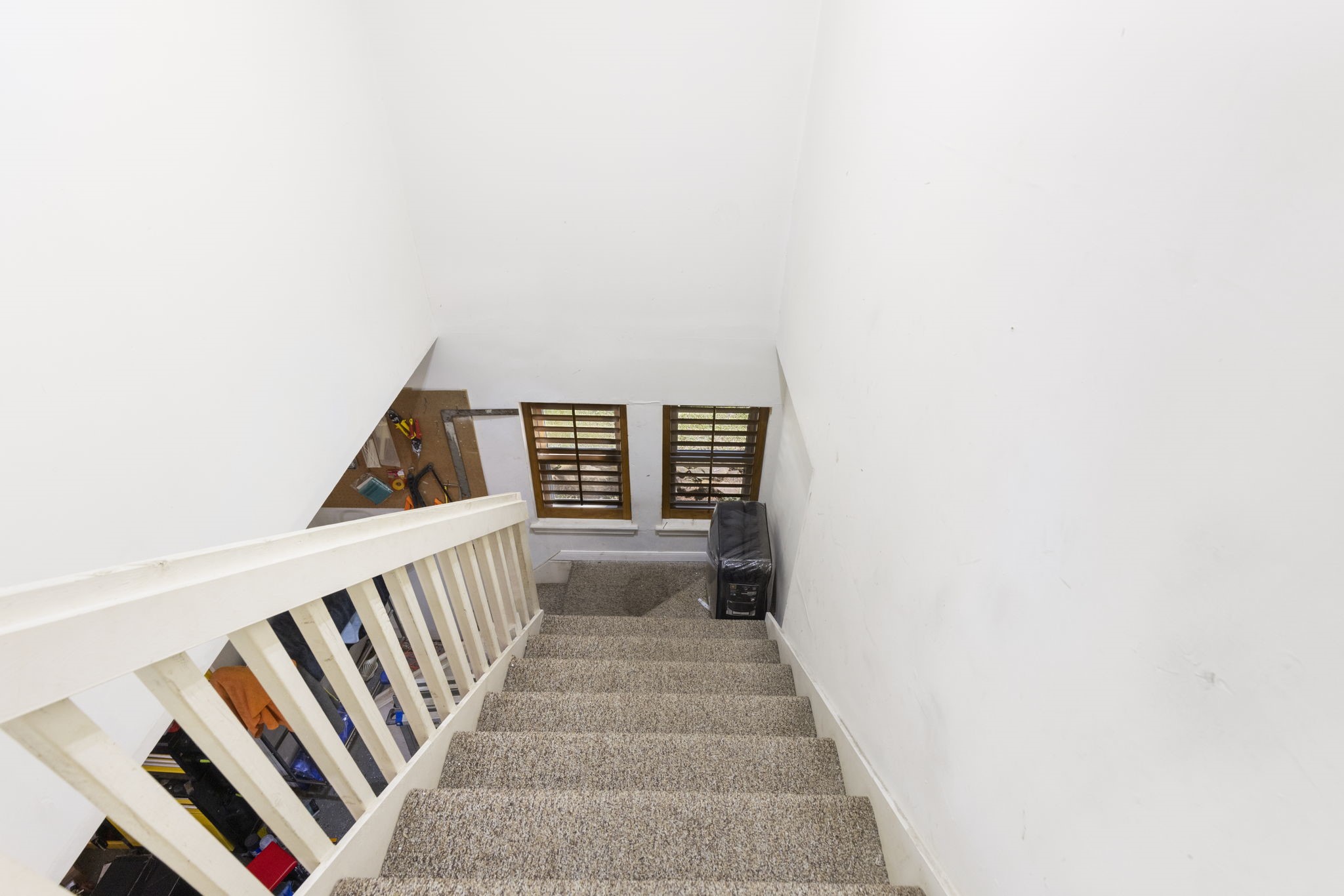 This staircase leads from the gameroom down to the extensive garage creating a private garage access to the upstairs.