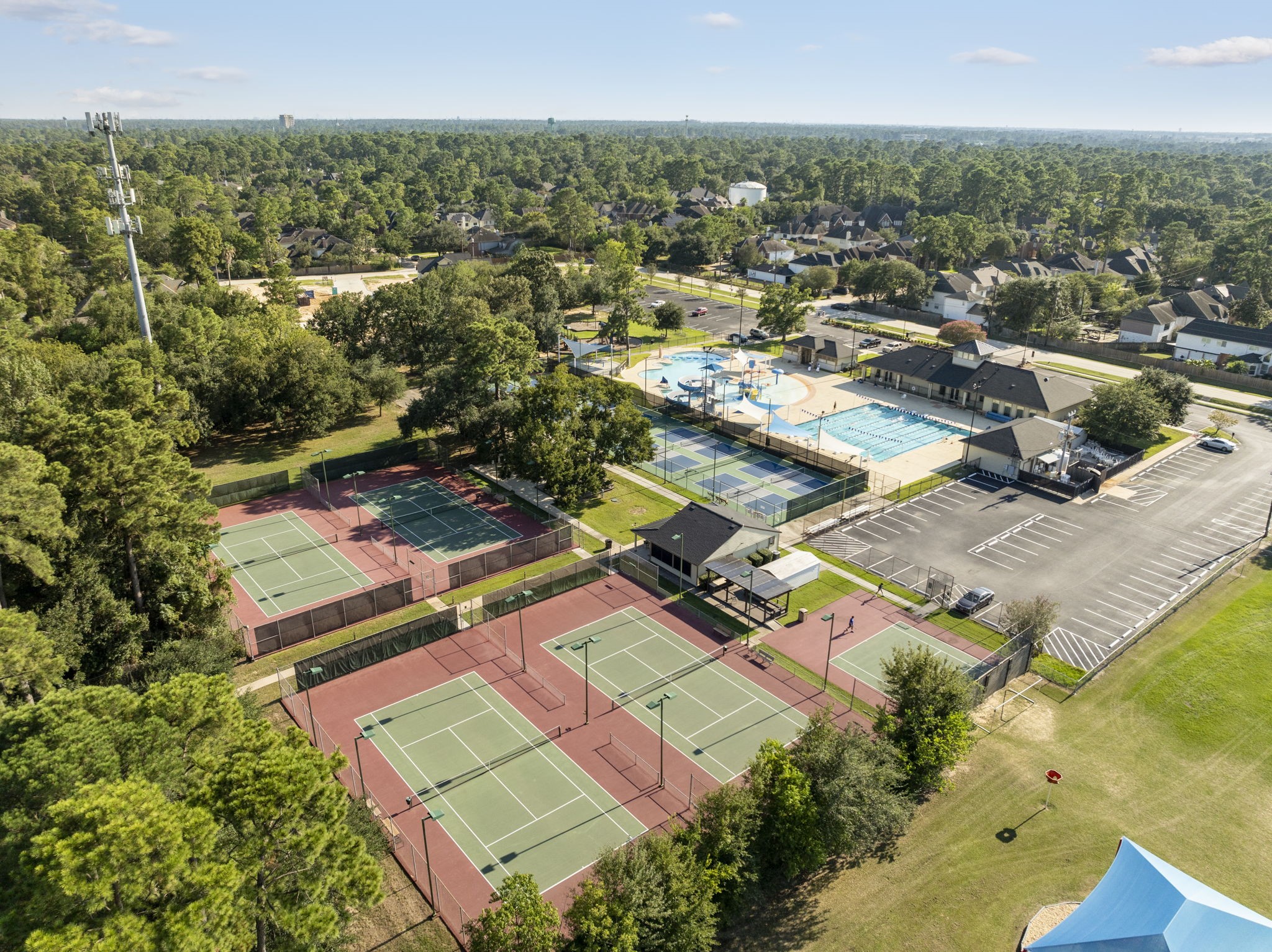 12 Lighted Tennis Courts fenced for viewing, Clubhouse w/Fitness Center, Childrens Playground,  Mile Jogging Track & more.