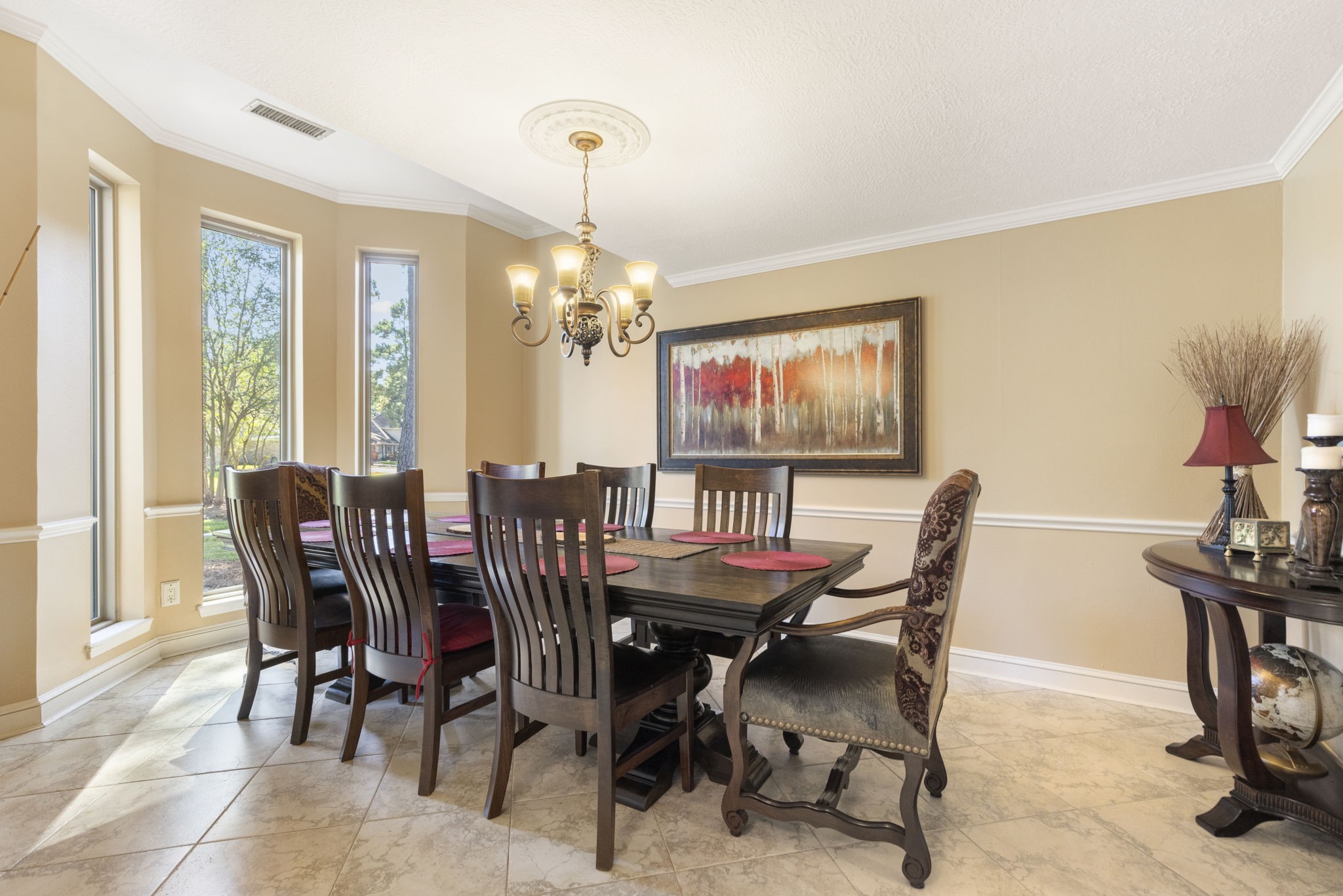 Formal dining room w/unique bay windows overlooking front yard is large enough to host your big dinner parties.