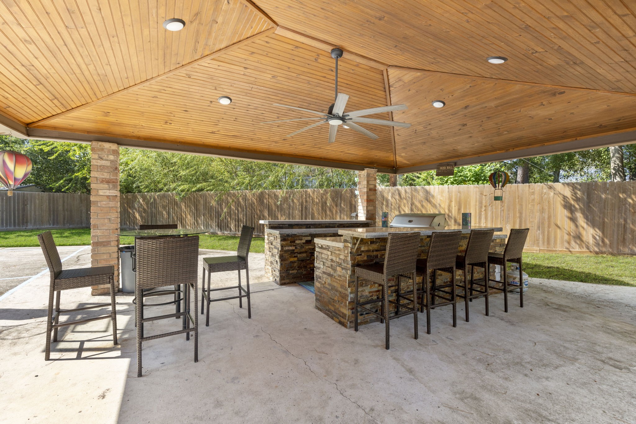 This huge covered summer kitchen area has incredible details and provides the best outdoor spot, come rain or shine.