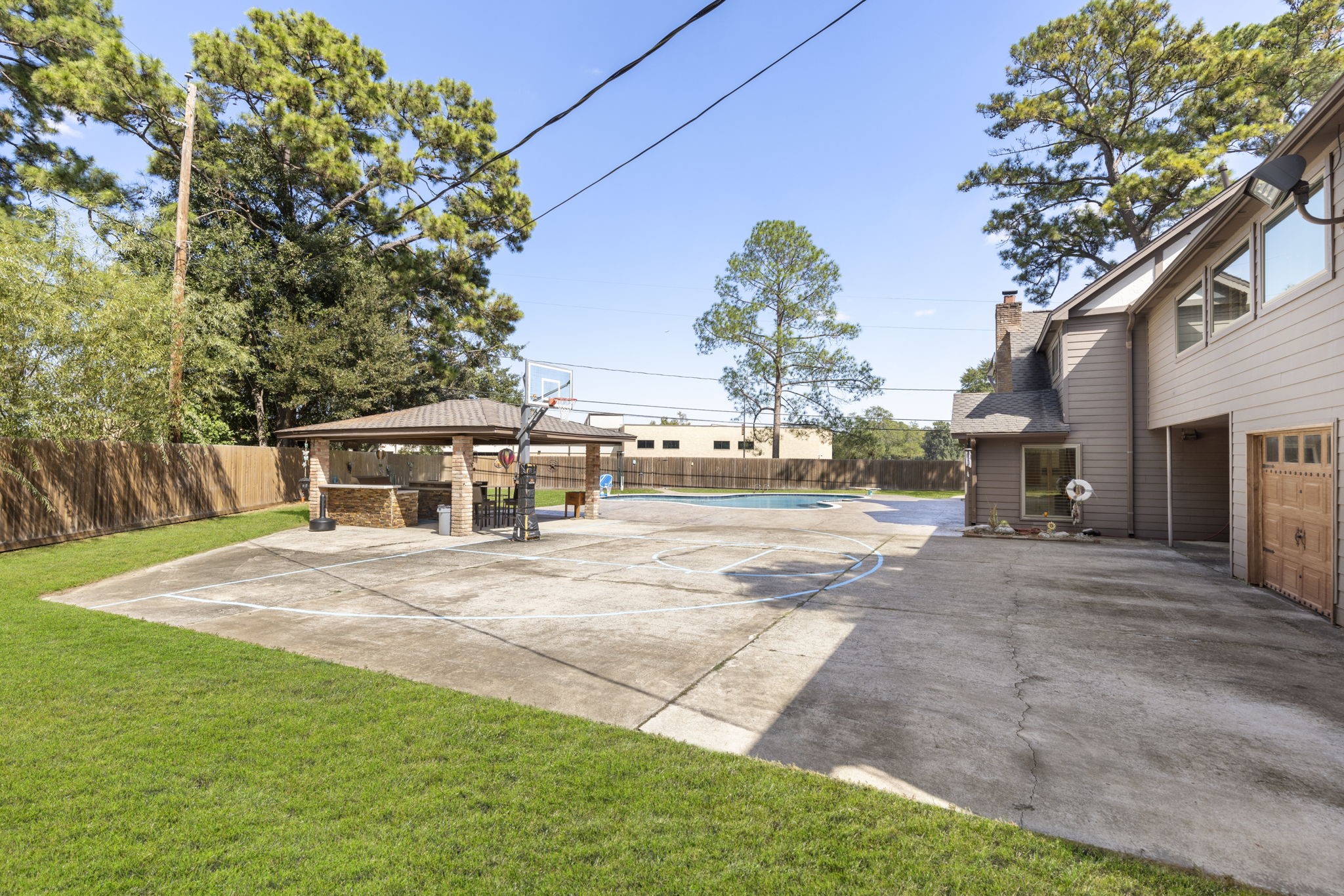 This backyard has been known to host highschool sports teams with so much space to hange out and play.