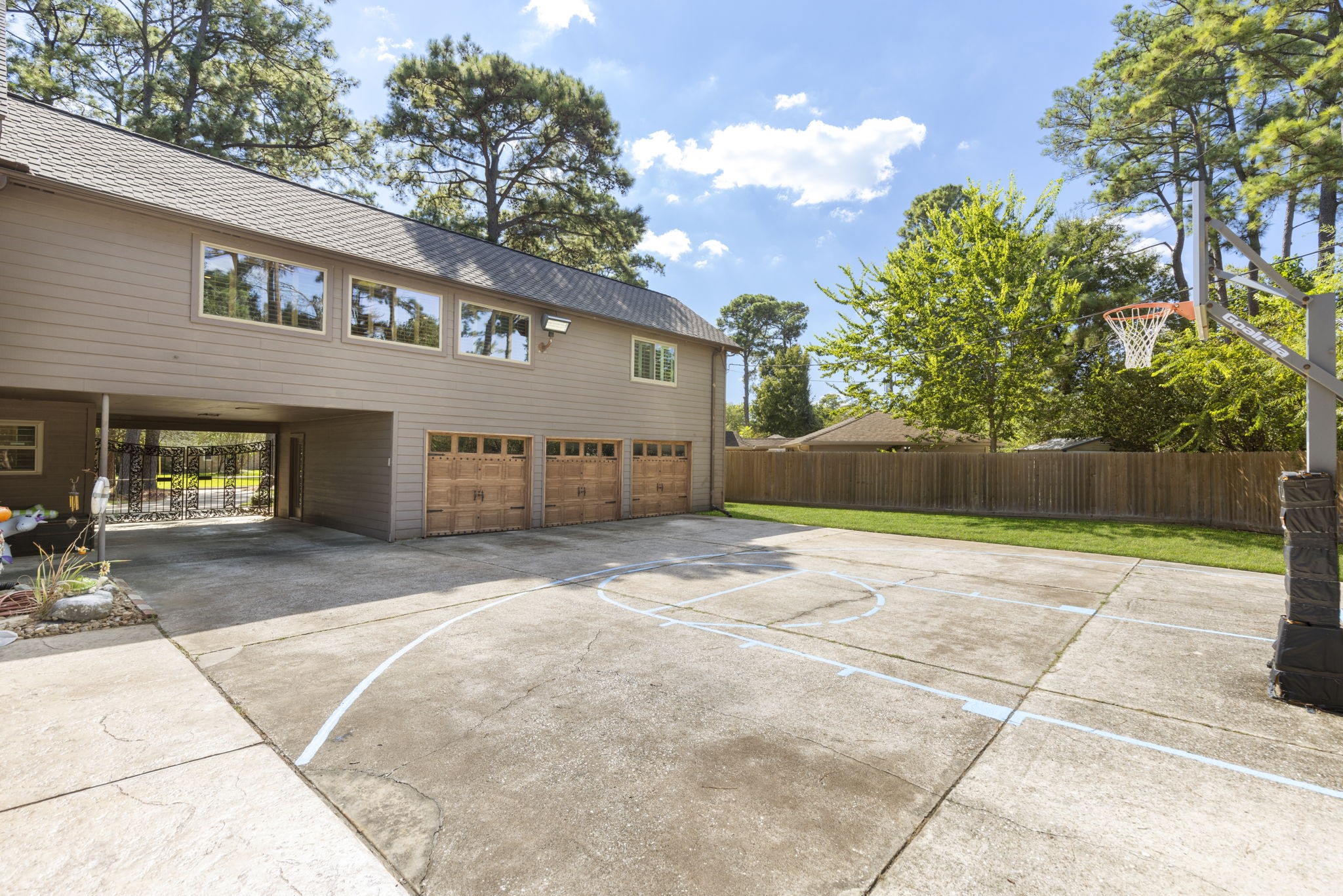 Huge patio area with basketball court is so unique and fun!