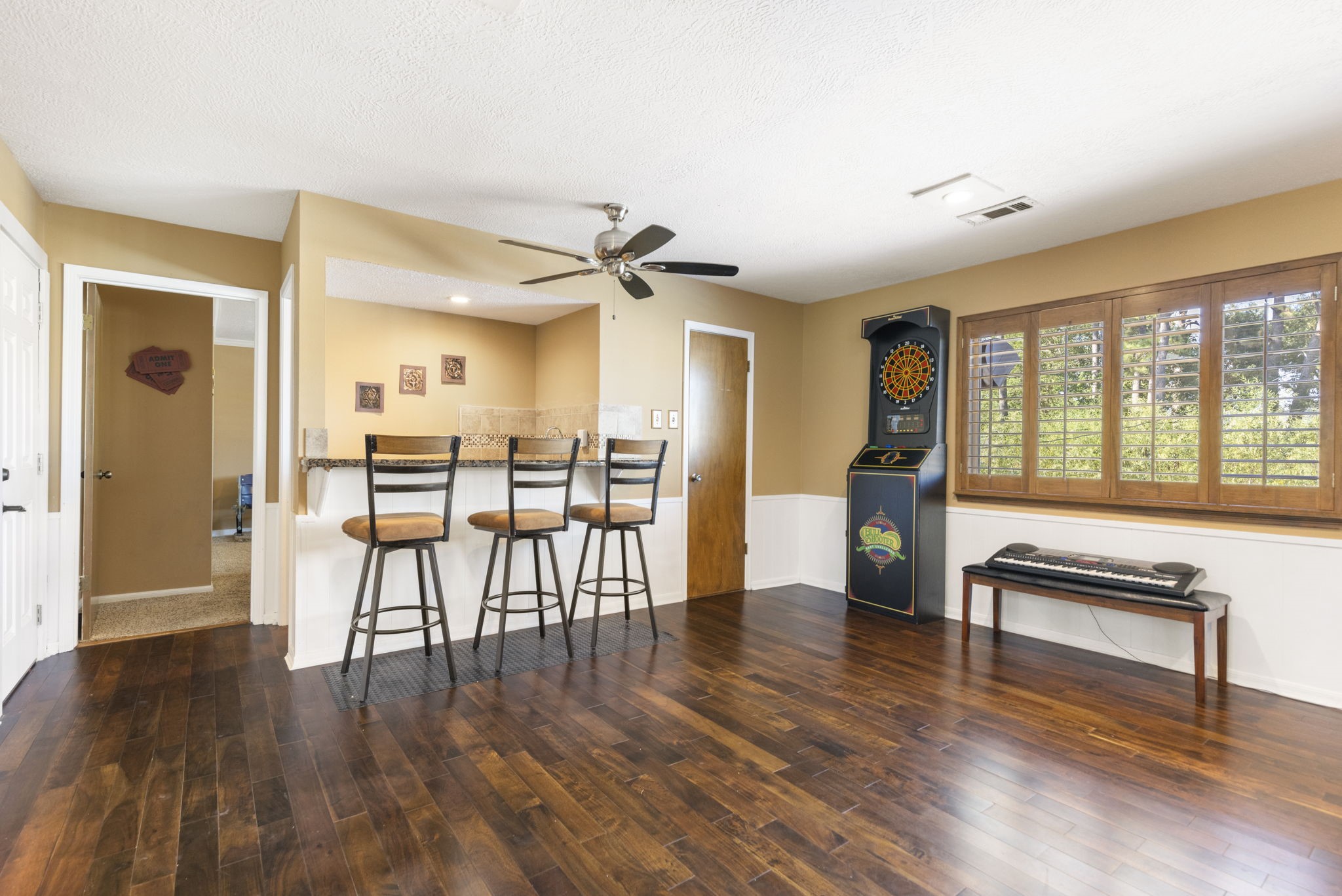 The gameroom has a wet bar, has a huge closet and leads to the media room.
