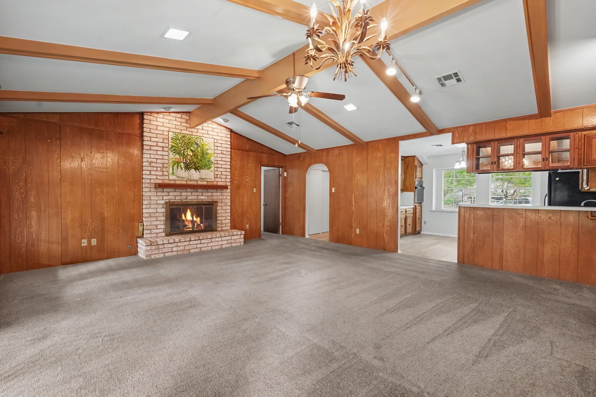 This cozy brick fireplace and hearth provide a warm, inviting focal point perfect for gatherings.